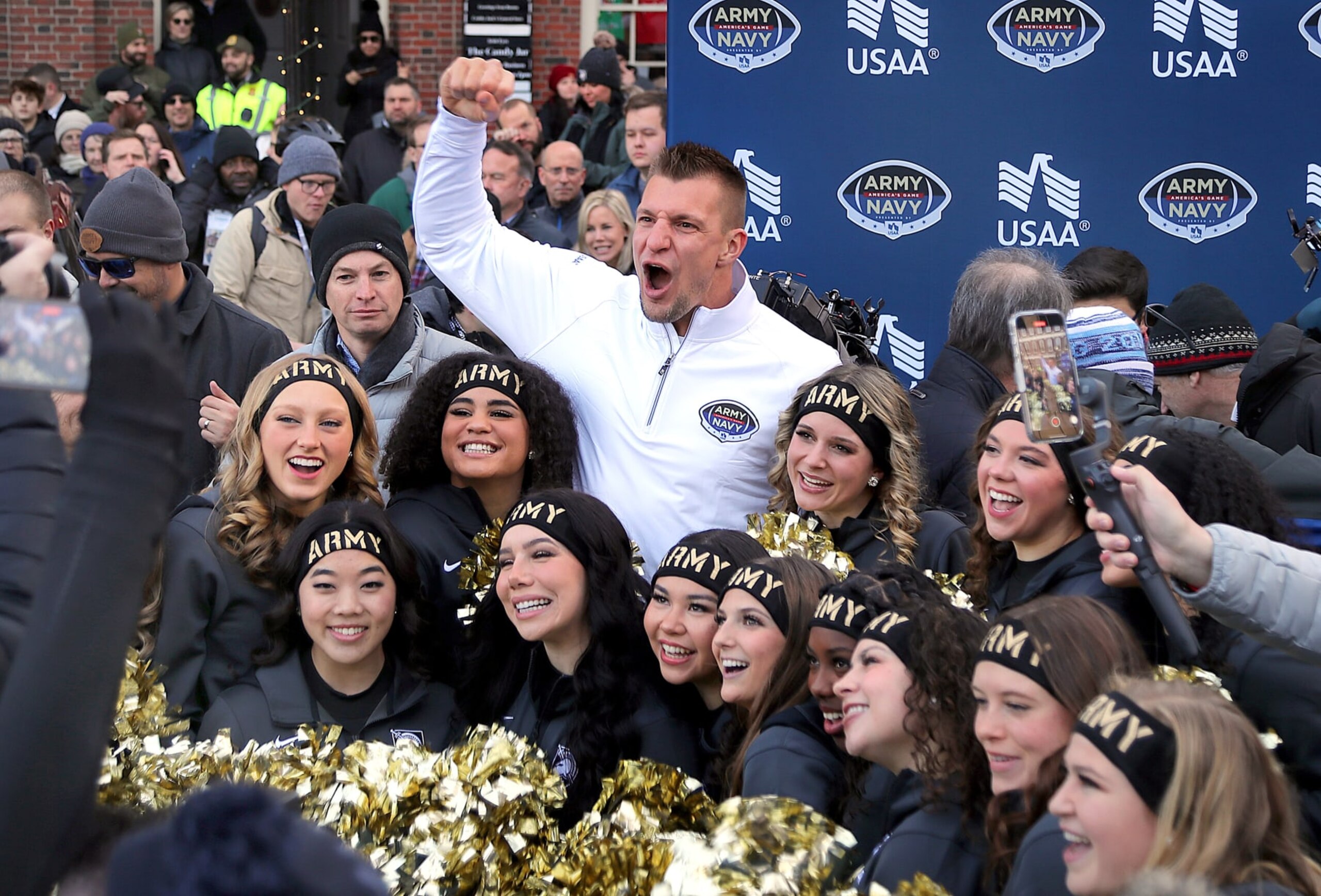 Boston, MA - December 8: Former New England Patriots TE Rob Gronkowski rallies with Army cheerleaders in front of Faneuil Hall. A parade and rally were help as a prelude to the Army Navy game. (Photo by John Tlumacki/The Boston Globe via Getty Images)