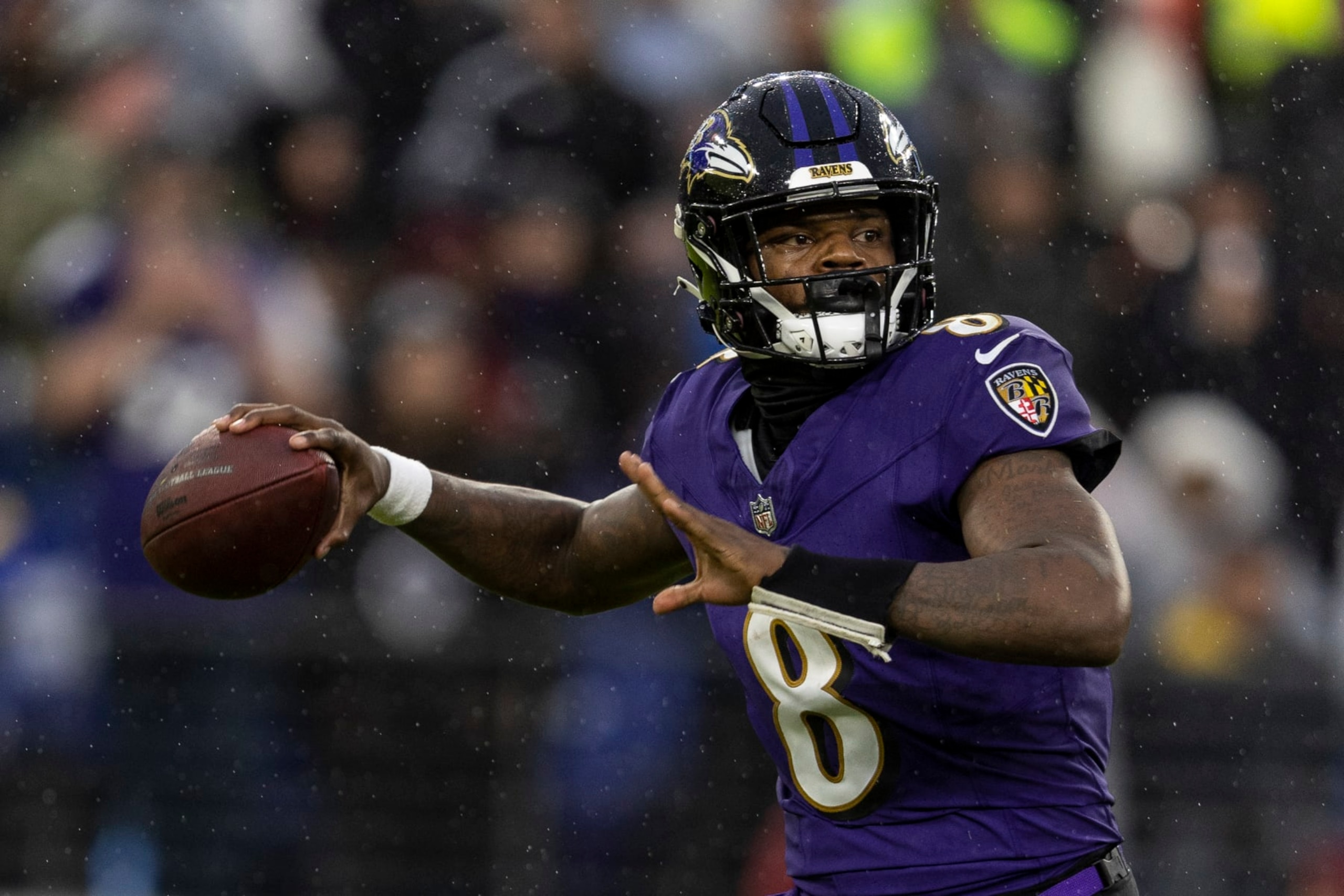 BALTIMORE, MARYLAND - DECEMBER 10: Lamar Jackson #8 of the Baltimore Ravens looks to pass during an NFL football game between the Baltimore Ravens and the Los Angeles Rams at M&T Bank Stadium on December 10, 2023 in Baltimore, Maryland. (Photo by Michael Owens/Getty Images)