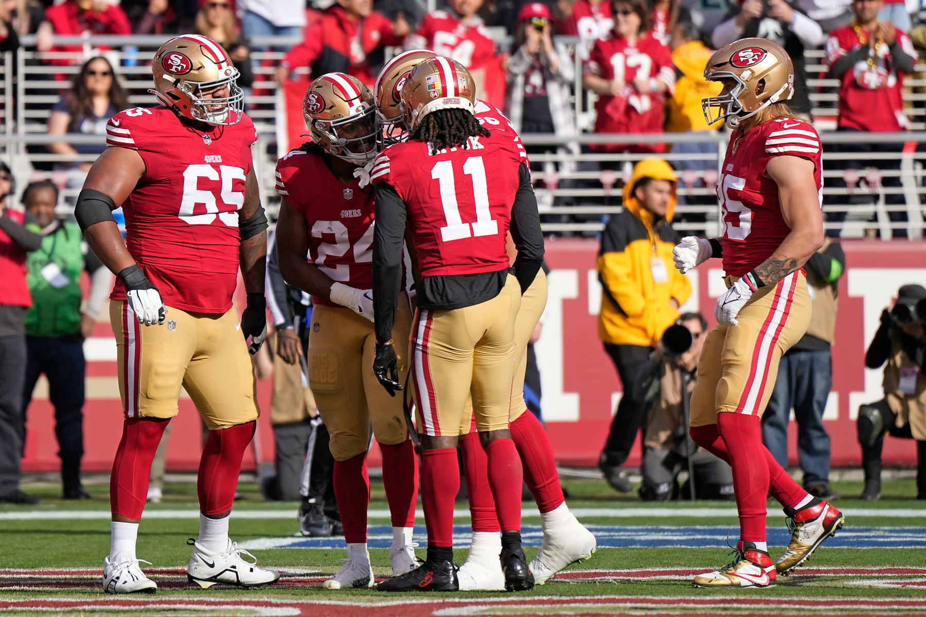 SANTA CLARA, CALIFORNIA - DECEMBER 10: Jordan Mason #24 of the San Francisco 49ers celebrates after a touchdown with teammates during the first quarter in the game against the Seattle Seahawks at Levi's Stadium on December 10, 2023 in Santa Clara, California. (Photo by Thearon W. Henderson/Getty Images)