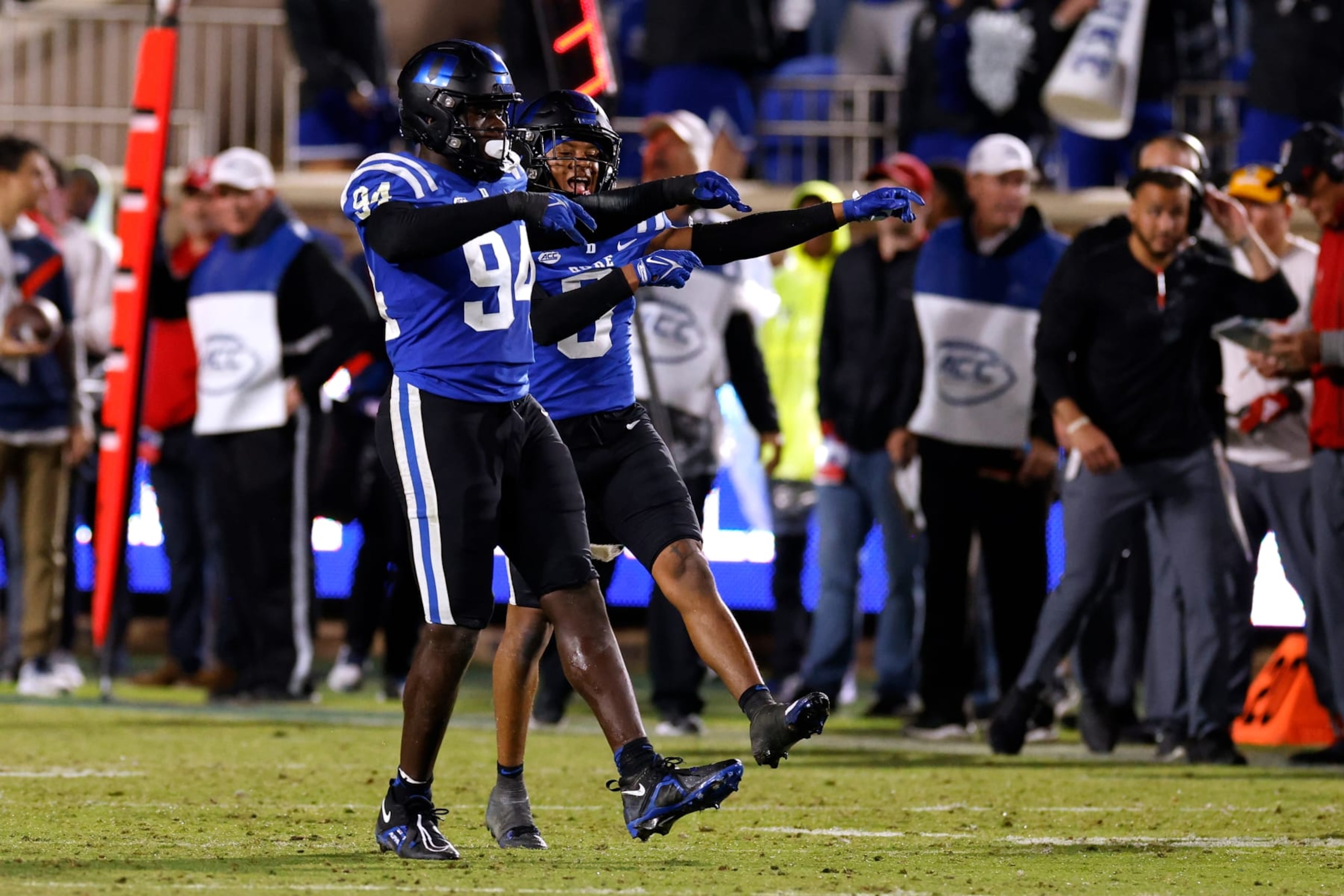 DURHAM, NORTH CAROLINA - OCTOBER 14: R.J. Oben #94 and Brandon Johnson #3 of the Duke Blue Devils react following a defensive play against the North Carolina State Wolfpack during the second half of the game at Wallace Wade Stadium on October 14, 2023 in Durham, North Carolina. Duke won 24-3. (Photo by Lance King/Getty Images)