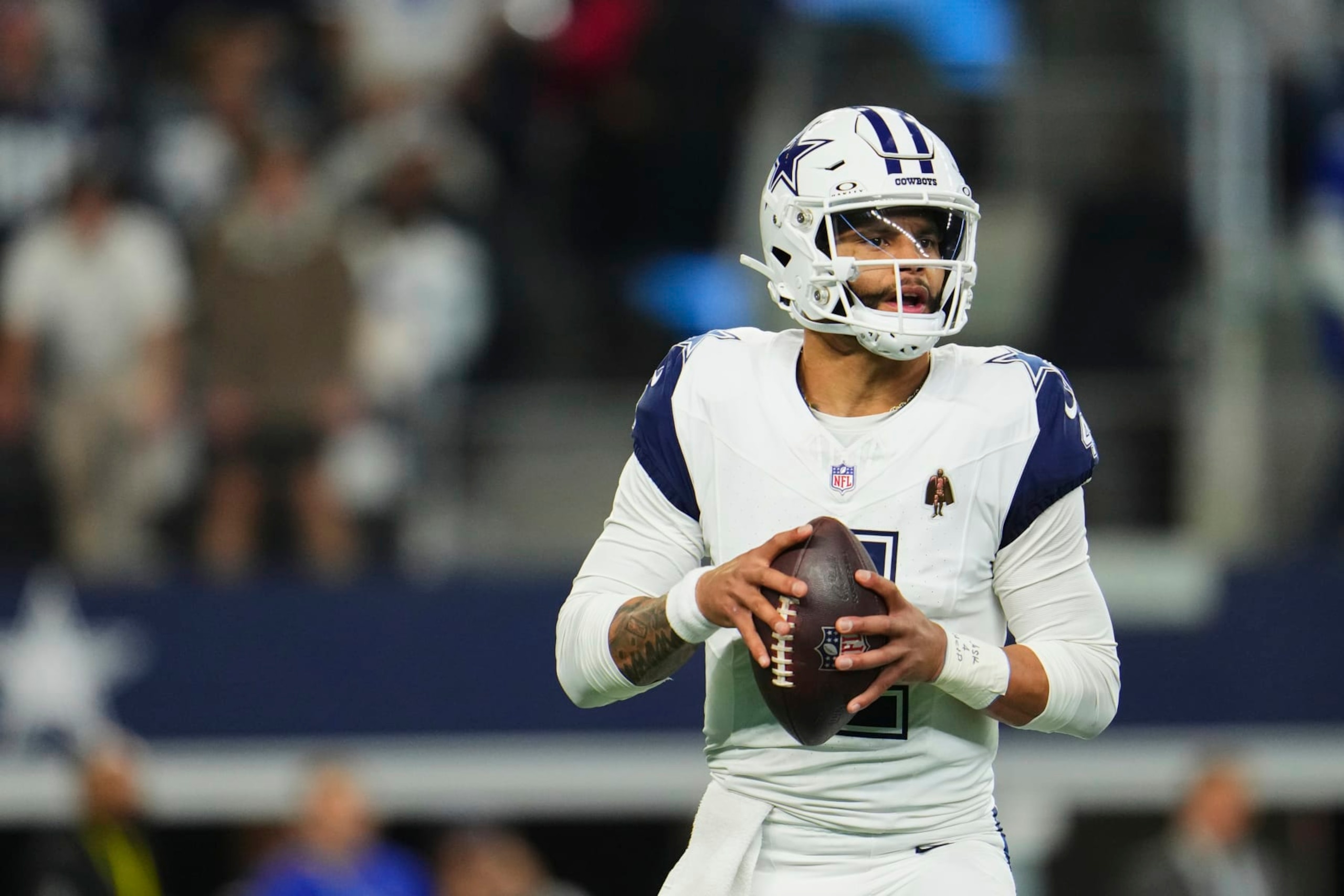 ARLINGTON, TX - DECEMBER 10: Dak Prescott #4 of the Dallas Cowboys drops back to pass against the Philadelphia Eagles during the first half at AT&T Stadium on December 10, 2023 in Arlington, Texas. (Photo by Cooper Neill/Getty Images)