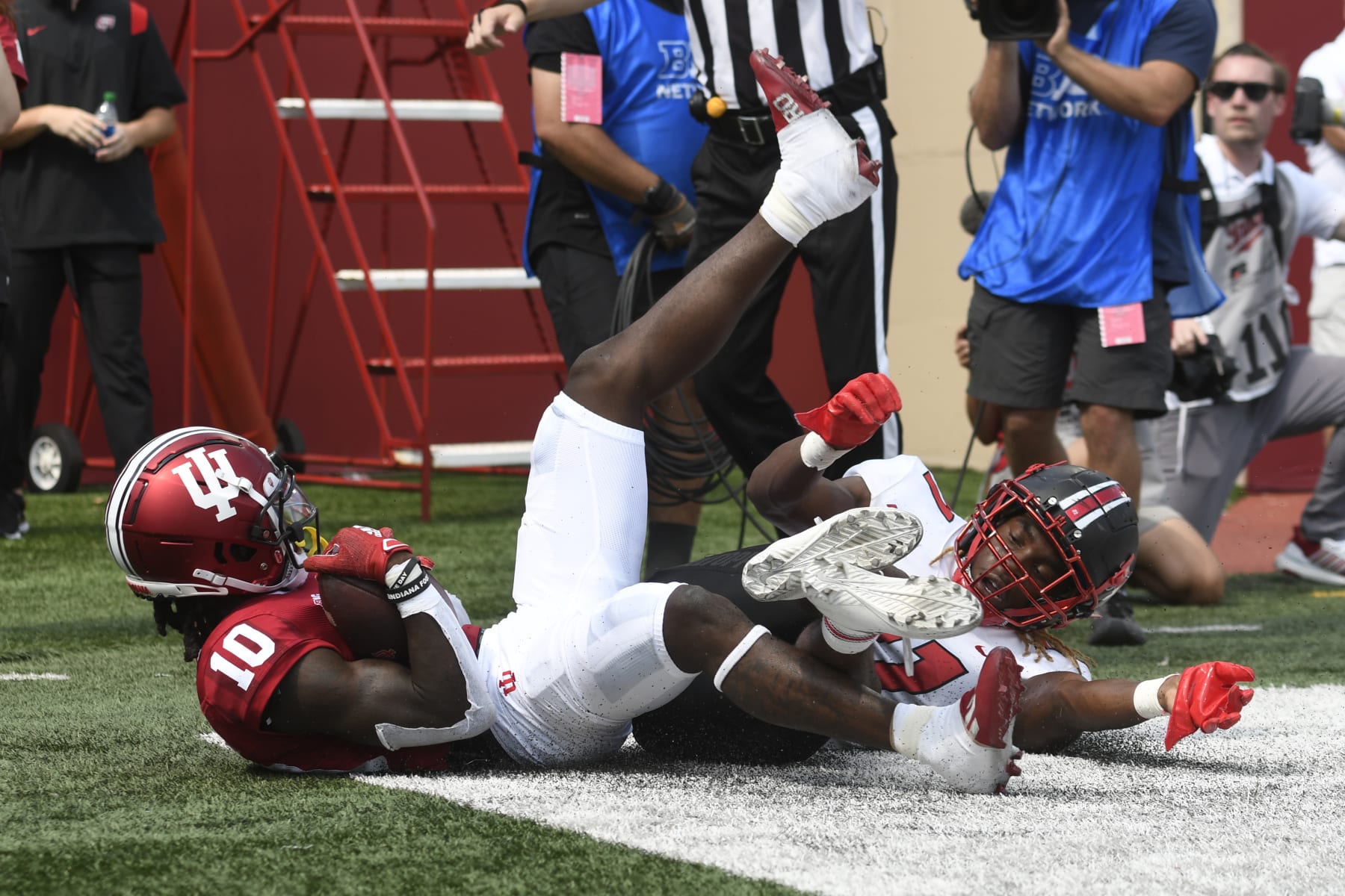 BLOOMINGTON, IN - SEPTEMBER 17: Indiana Hoosiers wide receiver Andison Coby (10) slides out of the back of the endzone after making a catch while Western Kentucky Hilltoppers defensive back Upton Stout (21) defends during the college football game between the Western Kentucky Hilltoppers and the Indiana Hoosiers on September 17, 2022, at Memorial Stadium in Bloomington, Indiana. (Photo by Michael Allio/Icon Sportswire via Getty Images)