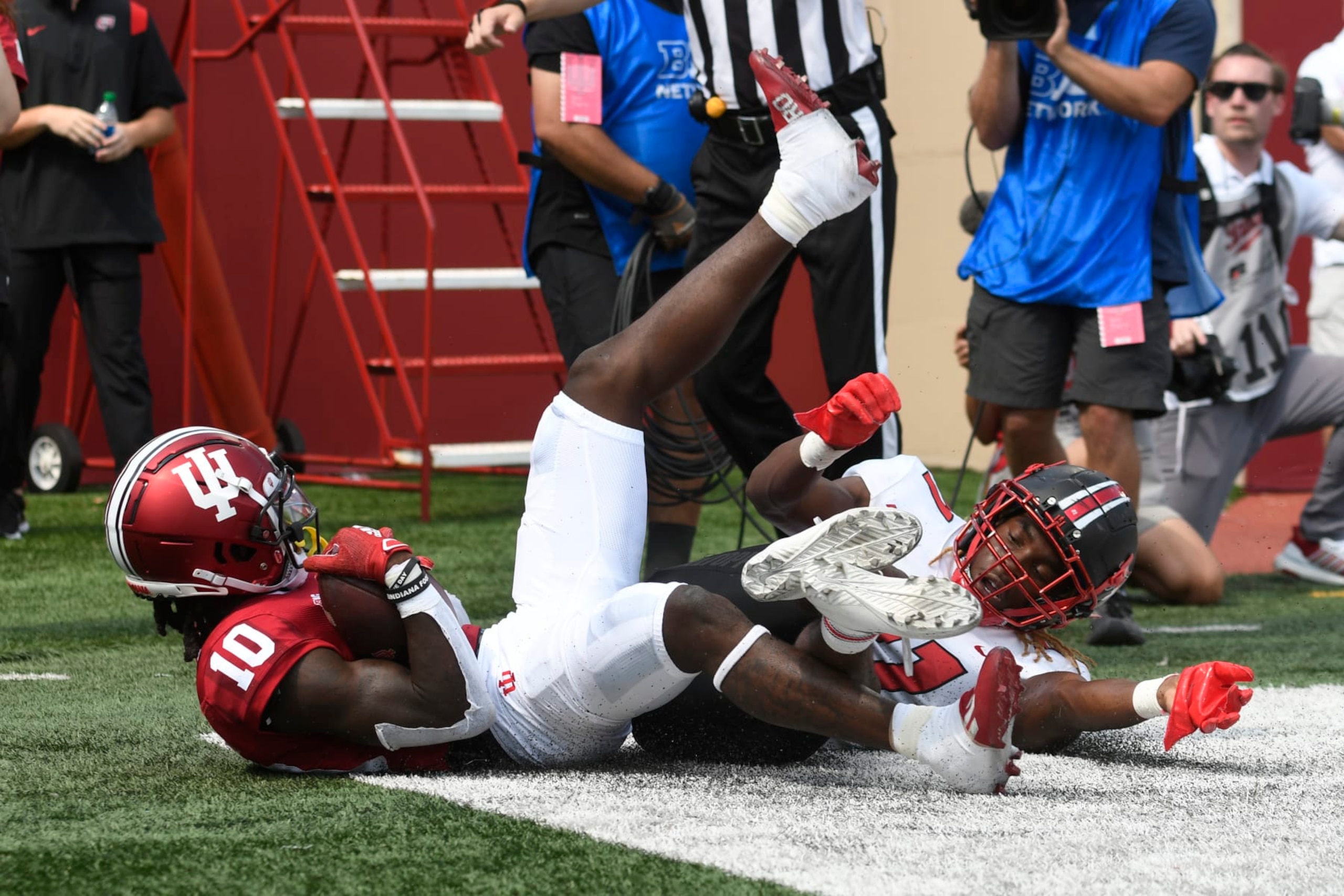 BLOOMINGTON, IN - SEPTEMBER 17: Indiana Hoosiers wide receiver Andison Coby (10) slides out of the back of the endzone after making a catch while Western Kentucky Hilltoppers defensive back Upton Stout (21) defends during the college football game between the Western Kentucky Hilltoppers and the Indiana Hoosiers on September 17, 2022, at Memorial Stadium in Bloomington, Indiana. (Photo by Michael Allio/Icon Sportswire via Getty Images)