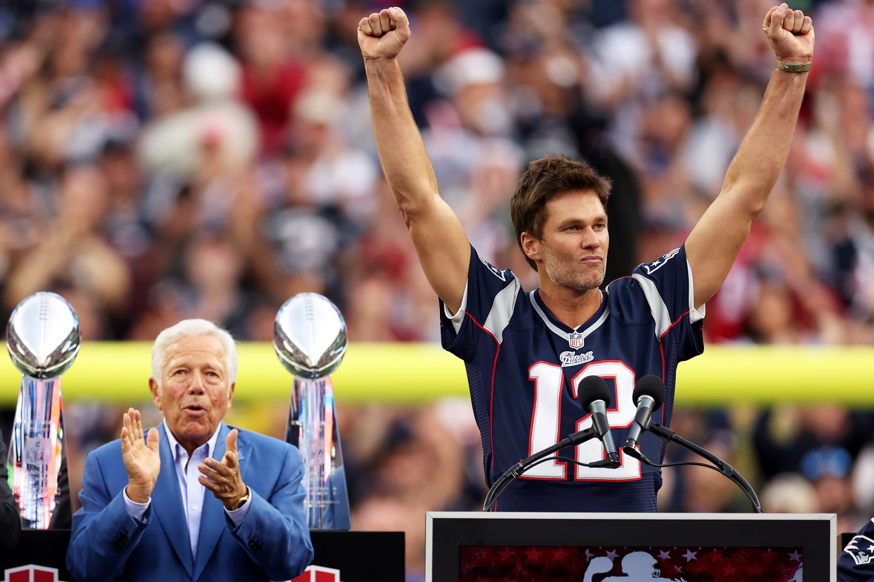 FOXBOROUGH, MASSACHUSETTS - SEPTEMBER 10: Former New England Patriots quarterback Tom Brady speaks next to Patriots Owner Robert Kraft during a ceremony honoring him at halftime of New England's game against the Philadelphia Eagles at Gillette Stadium on September 10, 2023 in Foxborough, Massachusetts. (Photo by Maddie Meyer/Getty Images)