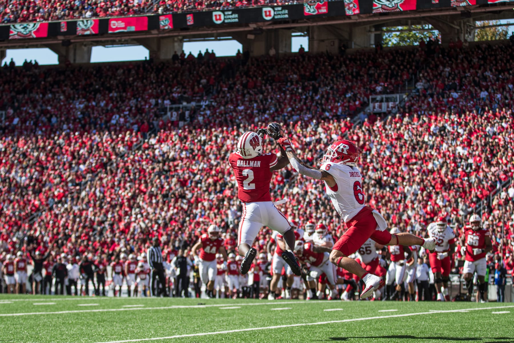 MADISON, WI - OCTOBER 07: Wisconsin Badgers corner back Ricardo Hallman (2) steps in front of Rutgers Scarlet Knights wide receiver Christian Dremel (6) for a pick 6 interception durning a college football game between the Rutgers Scarlet Knights and the Wisconsin Badgers on October 7th, 2023 at Barry Alvarez field at Camp Randall Stadium in Madison, WI. (Photo by Dan Sanger/Icon Sportswire via Getty Images)