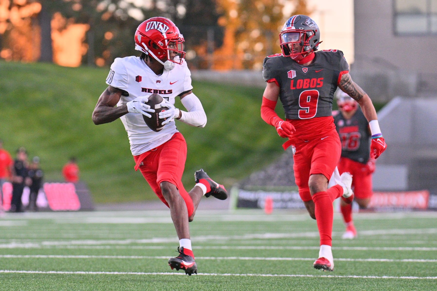 ALBUQUERQUE, NEW MEXICO - NOVEMBER 04: Wide receiver Ricky White #11 of the UNLV Rebels scores a touchdown after catching a pass against safety Noa Pola-Gates #9 of the New Mexico Lobos during the second half of their game at University Stadium on November 04, 2023 in Albuquerque, New Mexico. The Rebels defeated the Lobos 56-14. (Photo by Sam Wasson/Getty Images)