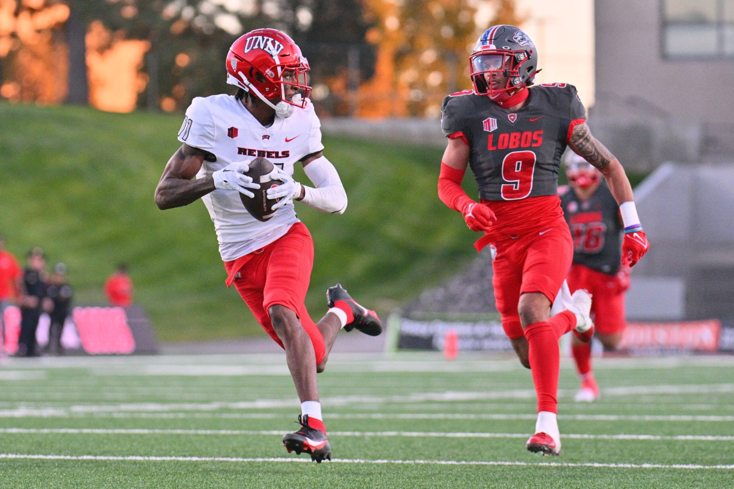 ALBUQUERQUE, NEW MEXICO - NOVEMBER 04: Wide receiver Ricky White #11 of the UNLV Rebels scores a touchdown after catching a pass against safety Noa Pola-Gates #9 of the New Mexico Lobos during the second half of their game at University Stadium on November 04, 2023 in Albuquerque, New Mexico. The Rebels defeated the Lobos 56-14. (Photo by Sam Wasson/Getty Images)