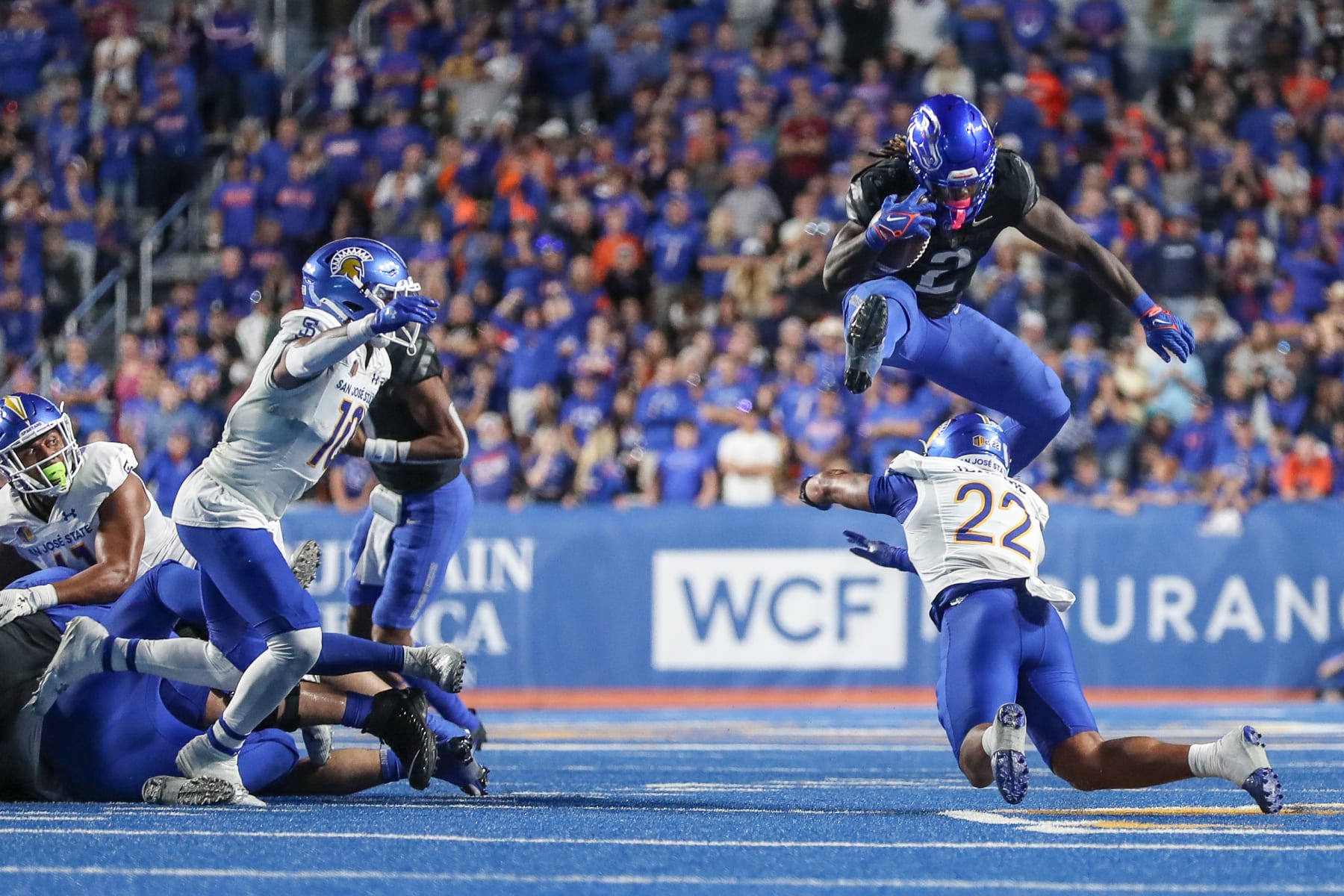 BOISE, ID - OCTOBER 7: Ashton Jeanty #2 of the Boise State Broncos hurdles Tre Jenkins #22 of the San Jose State Spartans during the second half at Albertsons Stadium on October 7, 2023 in Boise, Idaho. Boise State won the game 35-27. (Photo by Loren Orr/Getty Images)