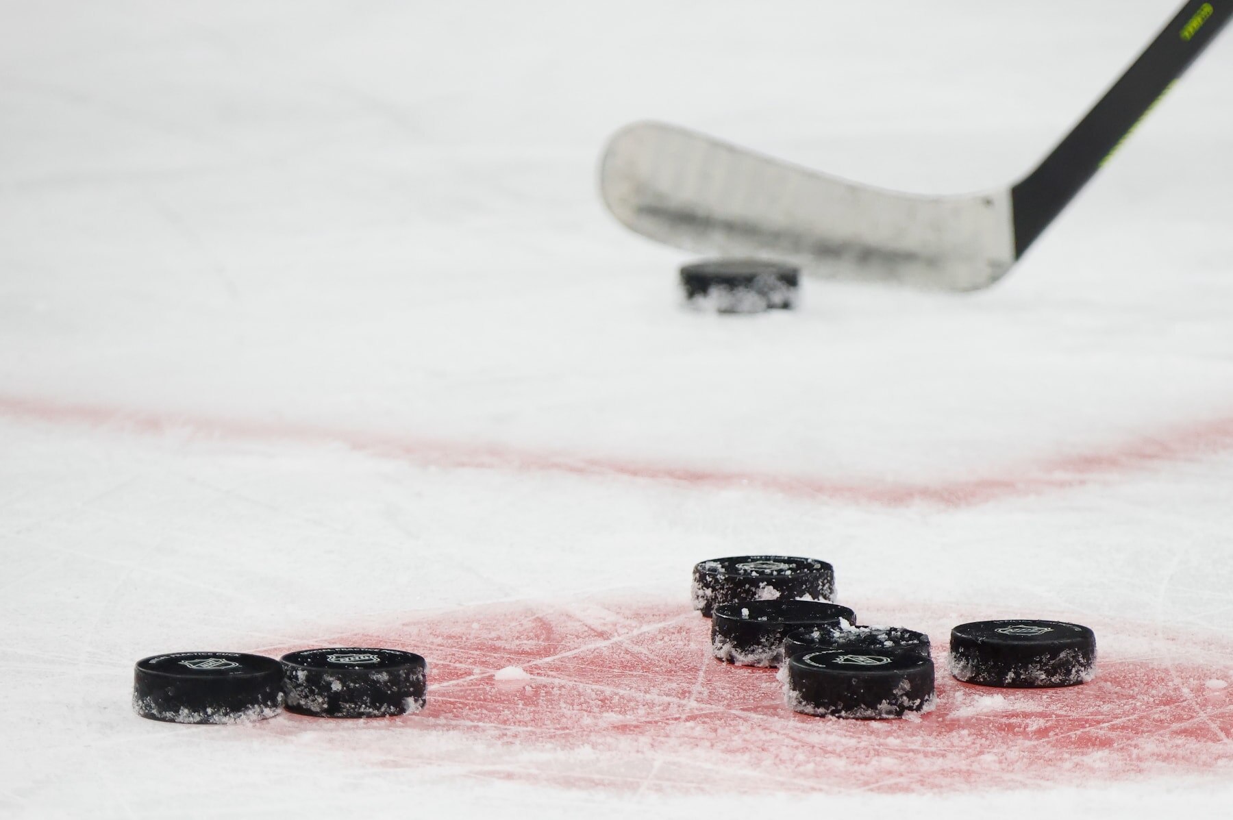 PITTSBURGH, PENNSYLVANIA - OCTOBER 10: A general view of a stick and pucks during the morning skate prior to the game between the Pittsburgh Penguins and the Chicago Blackhawks at PPG PAINTS Arena on October 10, 2023 in Pittsburgh, Pennsylvania. (Photo by Bruce Bennett/Getty Images)