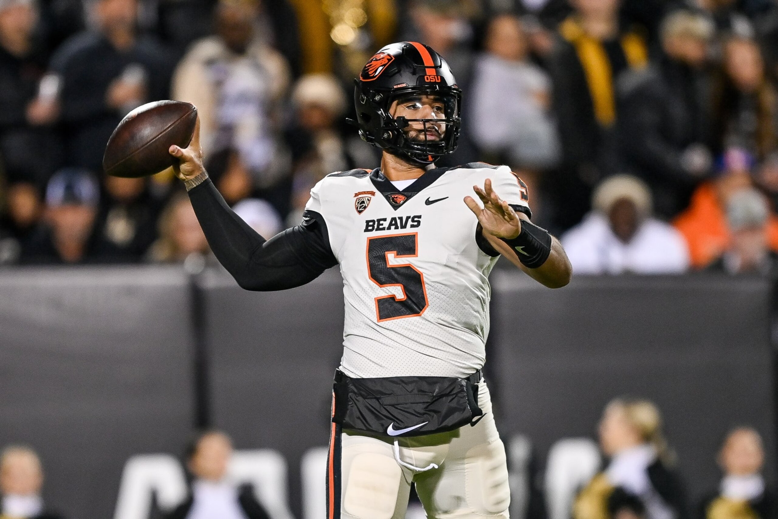 BOULDER, CO - NOVEMBER 4:  Quarterback DJ Uiagalelei #5 of the Oregon State Beavers passes against the Colorado Buffaloes in the first quarter at Folsom Field on November 4, 2023 in Boulder, Colorado. (Photo by Dustin Bradford/Getty Images)