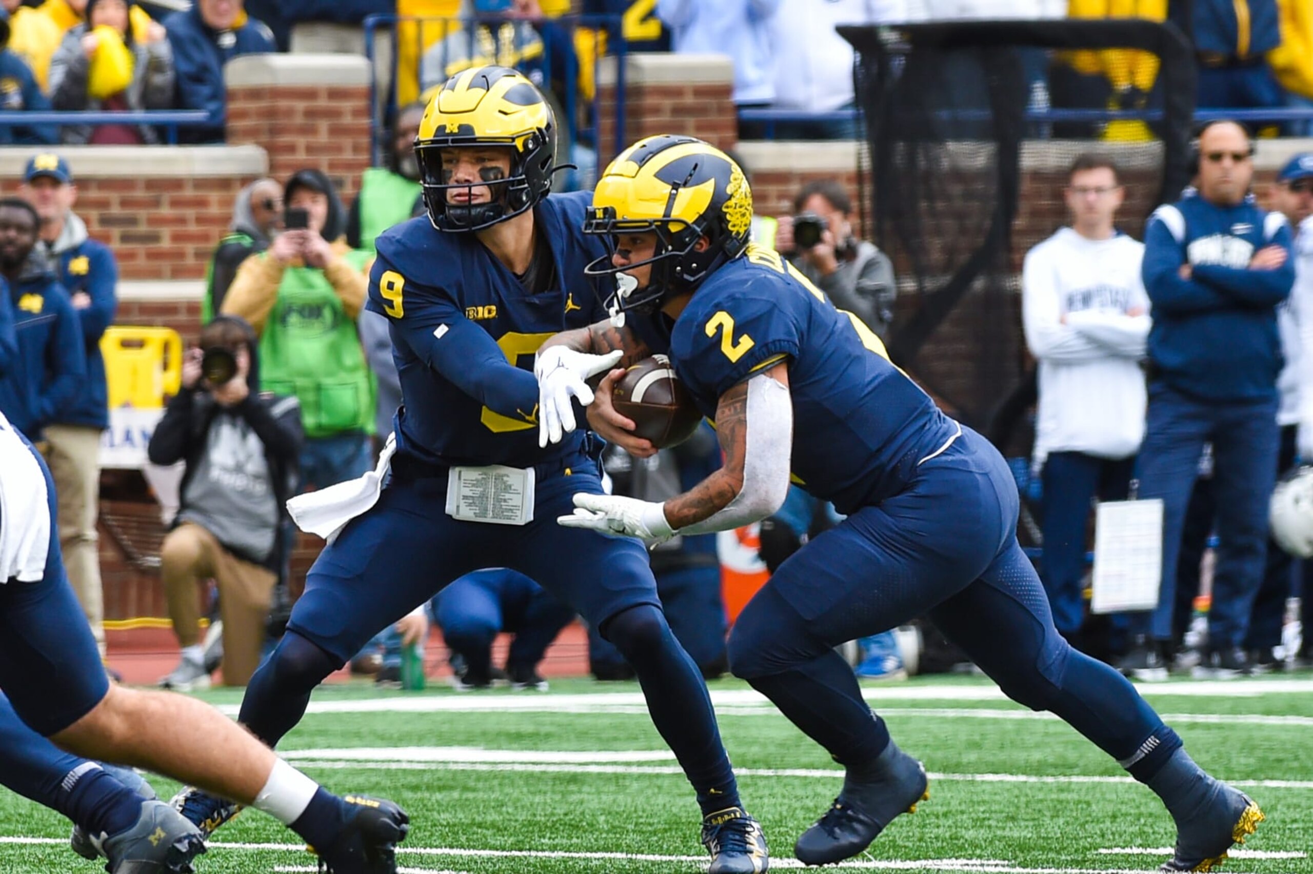 ANN ARBOR, MICHIGAN - OCTOBER 15: J.J. McCarthy #9 hands the ball off to Blake Corum #2 of the Michigan Wolverines during the first half of a college football game against the Penn State Nittany Lions at Michigan Stadium on October 15, 2022 in Ann Arbor, Michigan. (Photo by Aaron J. Thornton/Getty Images)