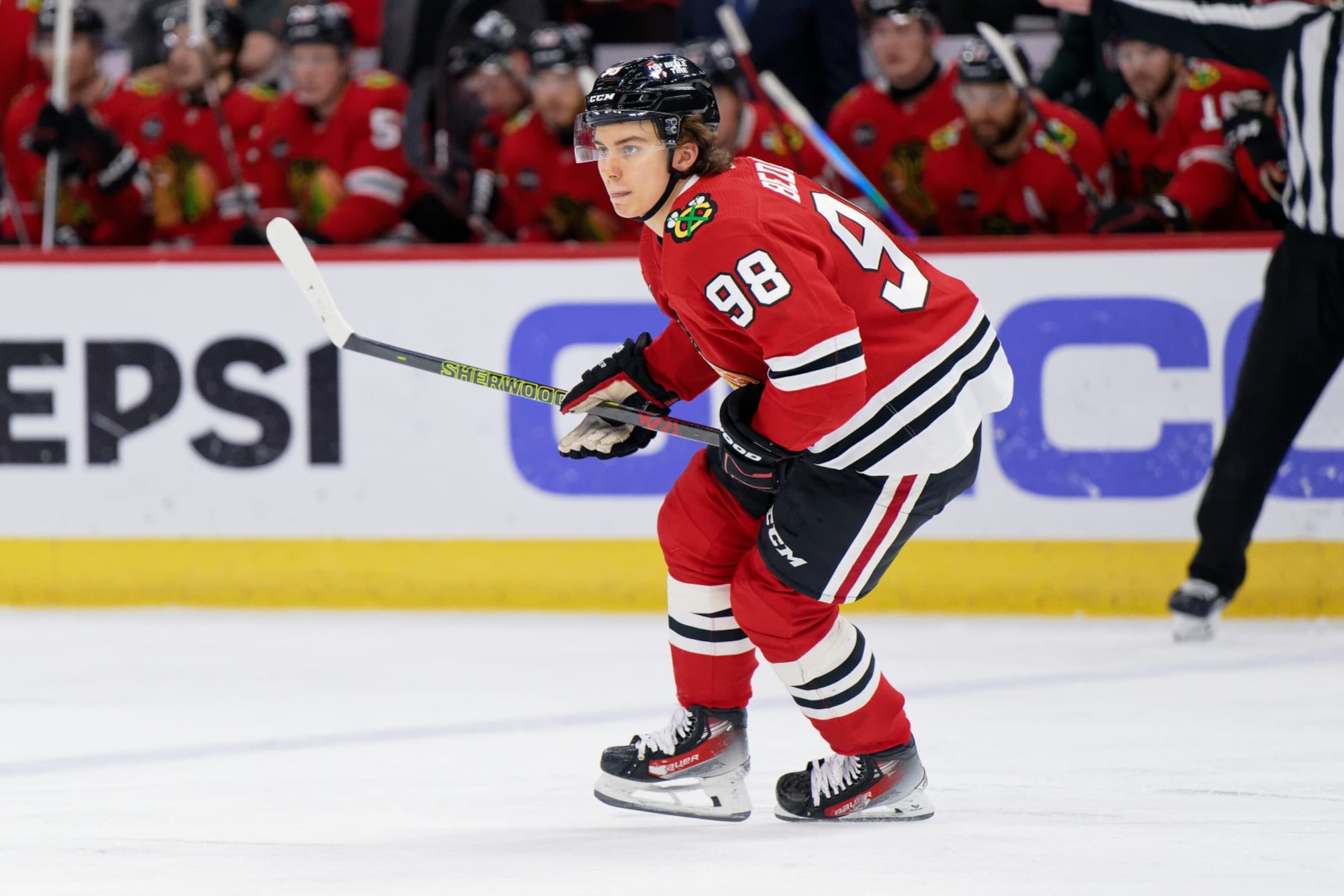 CHICAGO, ILLINOIS - DECEMBER 10:  Connor Bedard #98 of the Chicago Blackhawks skates against the Washington Capitals on December 10, 2023 at United Center in Chicago, Illinois.  (Photo by Jamie Sabau/Getty Images)