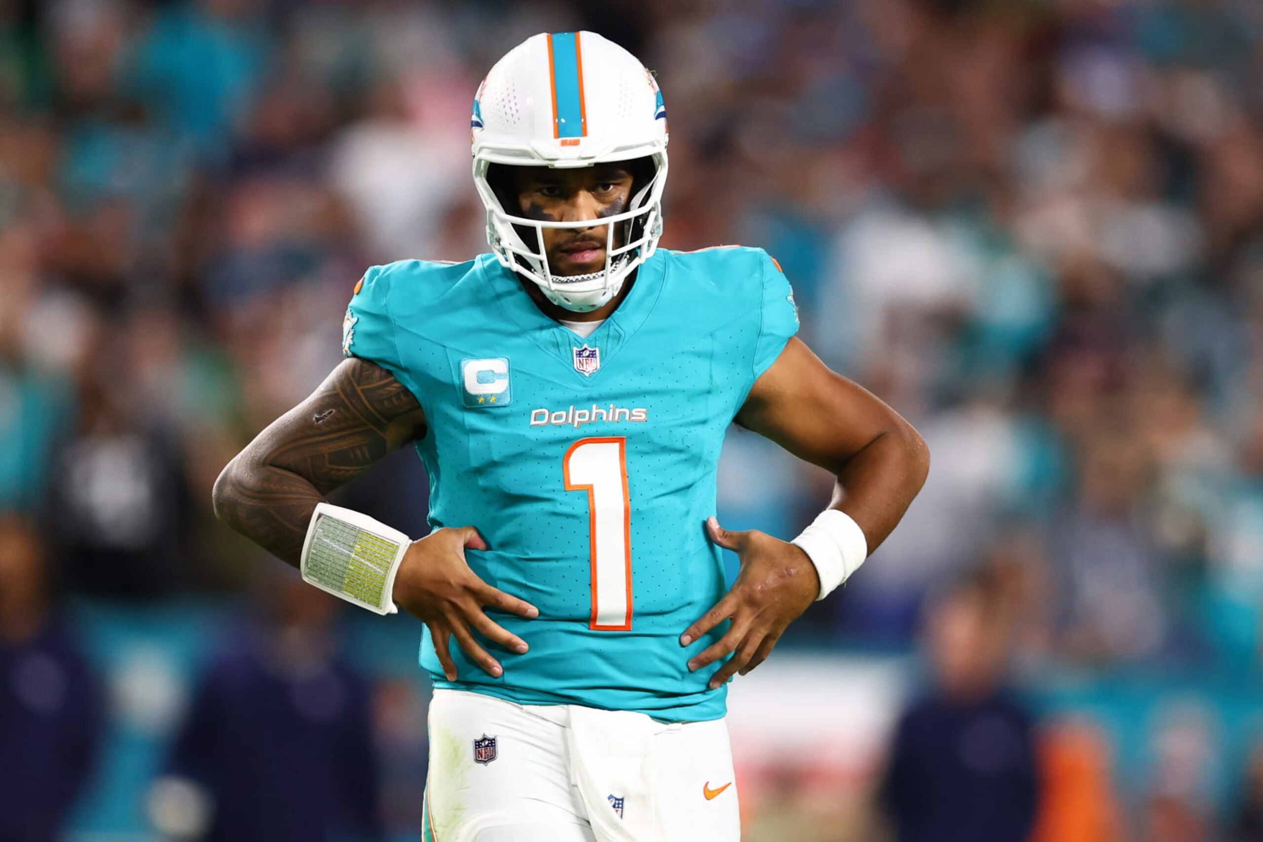 MIAMI GARDENS, FLORIDA - DECEMBER 11: Tua Tagovailoa #1 of the Miami Dolphins looks on during the fourth quarter of the game against the Tennessee Titans at Hard Rock Stadium on December 11, 2023 in Miami Gardens, Florida. (Photo by Megan Briggs/Getty Images)
