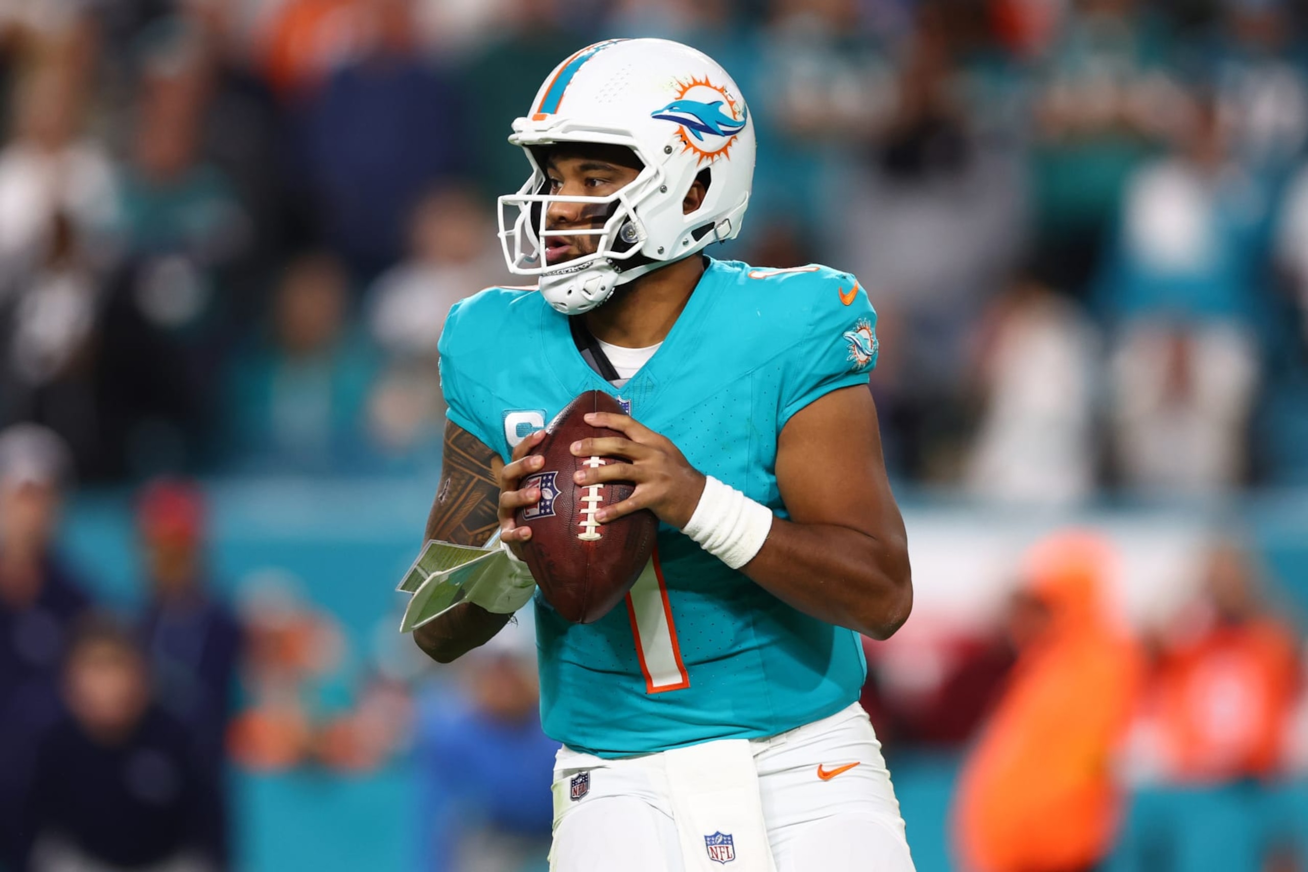 MIAMI GARDENS, FLORIDA - DECEMBER 11: Tua Tagovailoa #1 of the Miami Dolphins looks to pass during the fourth quarter of the game against the Tennessee Titans at Hard Rock Stadium on December 11, 2023 in Miami Gardens, Florida. (Photo by Megan Briggs/Getty Images)