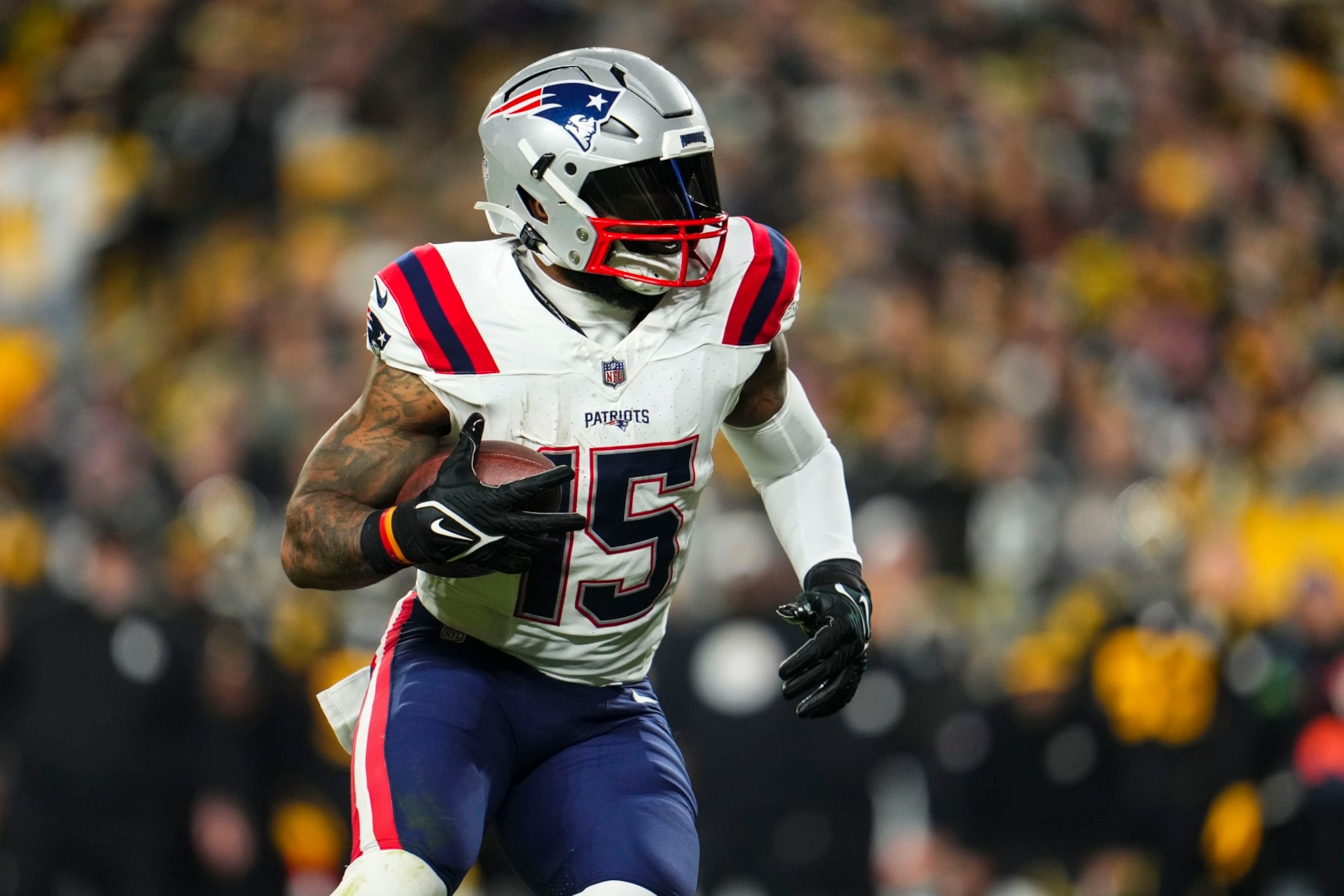 PITTSBURGH, PA - DECEMBER 07: Ezekiel Elliott #15 of the New England Patriots runs the ball during an NFL football game against the Pittsburgh Steelers at Acrisure Stadium on December 7, 2023 in Pittsburgh, Pennsylvania. (Photo by Cooper Neill/Getty Images)