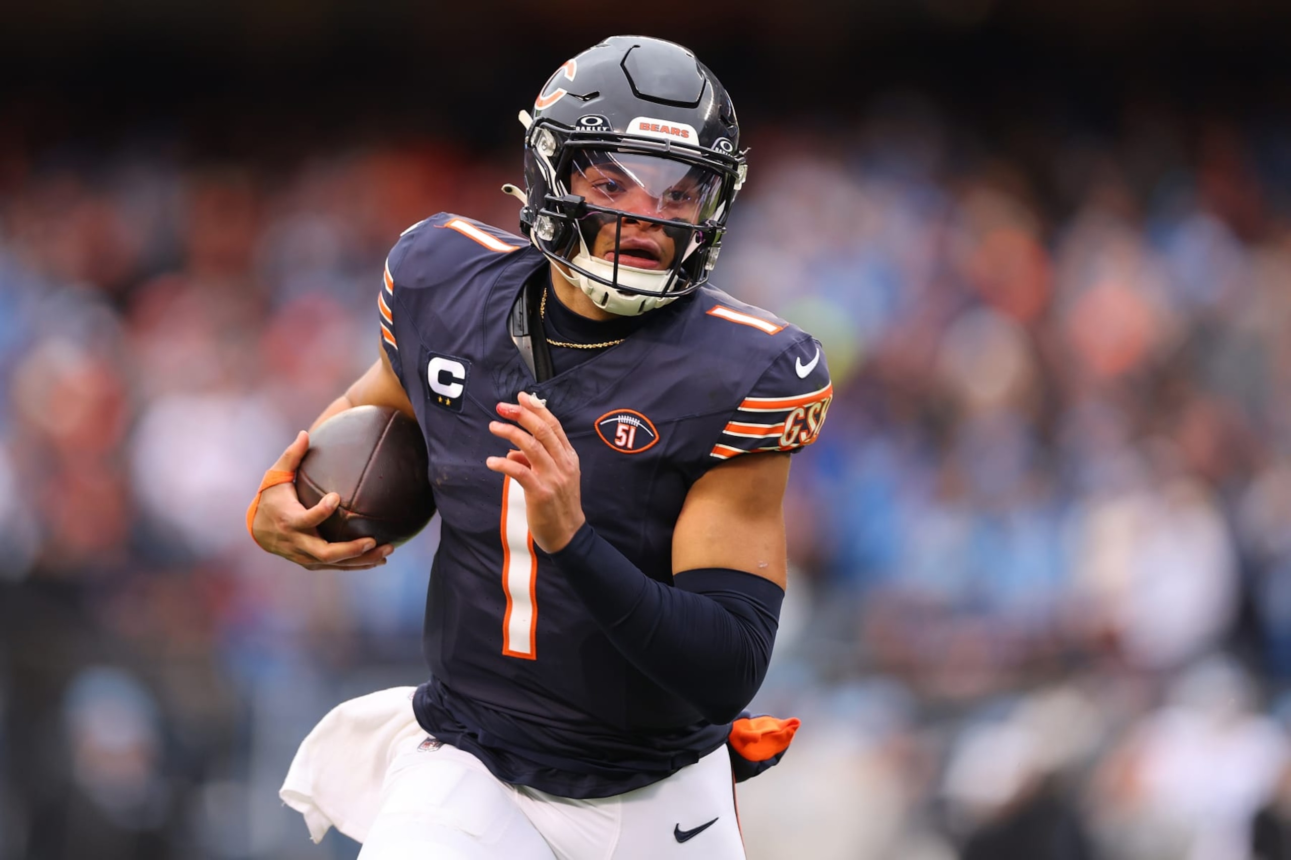 CHICAGO, ILLINOIS - DECEMBER 10: Justin Fields #1 of the Chicago Bears runs the ball during the first quarter in the game against the Detroit Lions at Soldier Field on December 10, 2023 in Chicago, Illinois. (Photo by Michael Reaves/Getty Images)