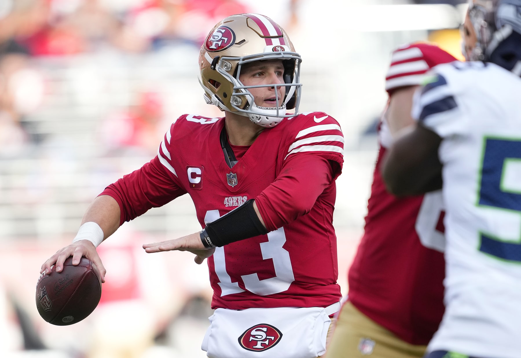 SANTA CLARA, CALIFORNIA - DECEMBER 10: Brock Purdy #13 of the San Francisco 49ers drops back to pass against the Seattle Seahawks during the second quarter of an NFL football game at Levi's Stadium on December 10, 2023 in Santa Clara, California. (Photo by Thearon W. Henderson/Getty Images)