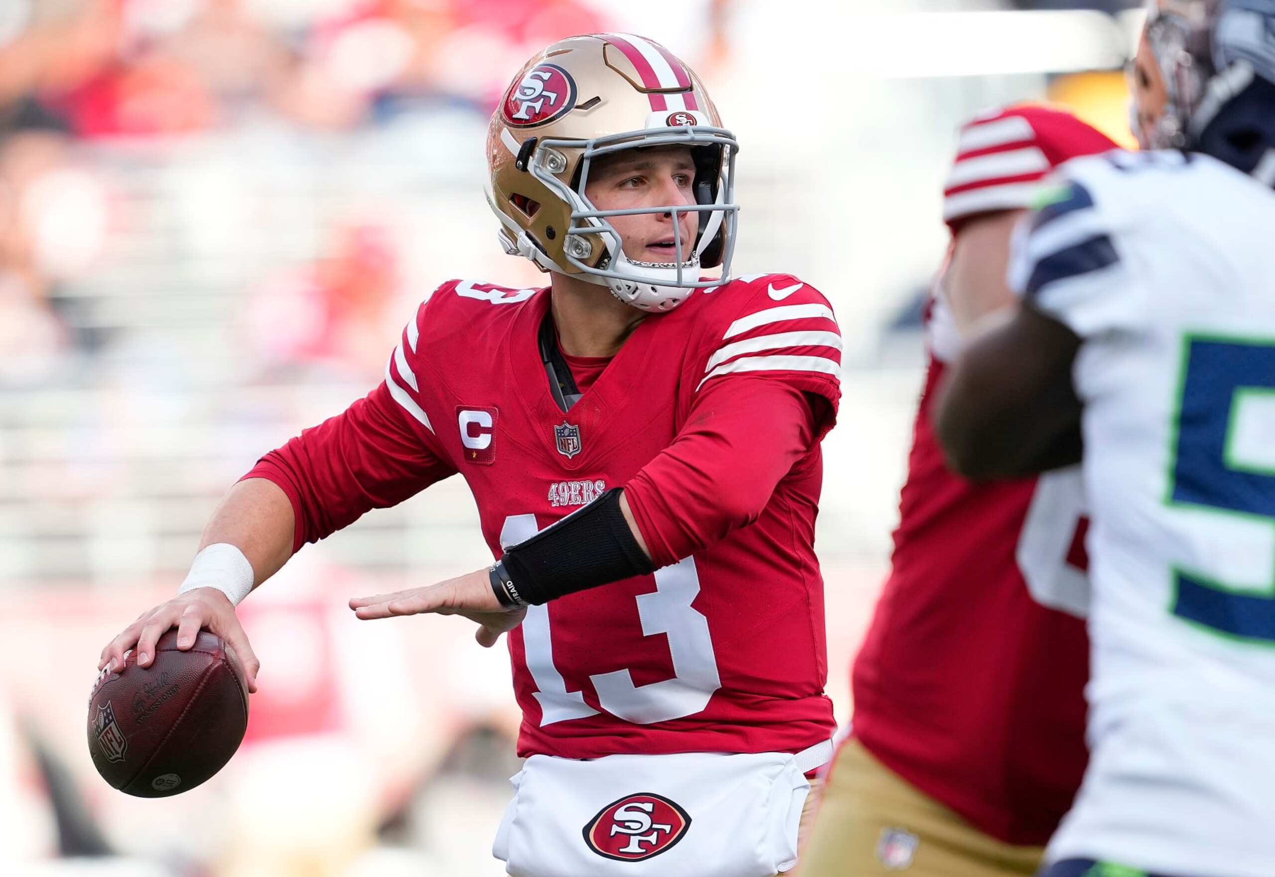 SANTA CLARA, CALIFORNIA - DECEMBER 10: Brock Purdy #13 of the San Francisco 49ers drops back to pass against the Seattle Seahawks during the second quarter of an NFL football game at Levi's Stadium on December 10, 2023 in Santa Clara, California. (Photo by Thearon W. Henderson/Getty Images)