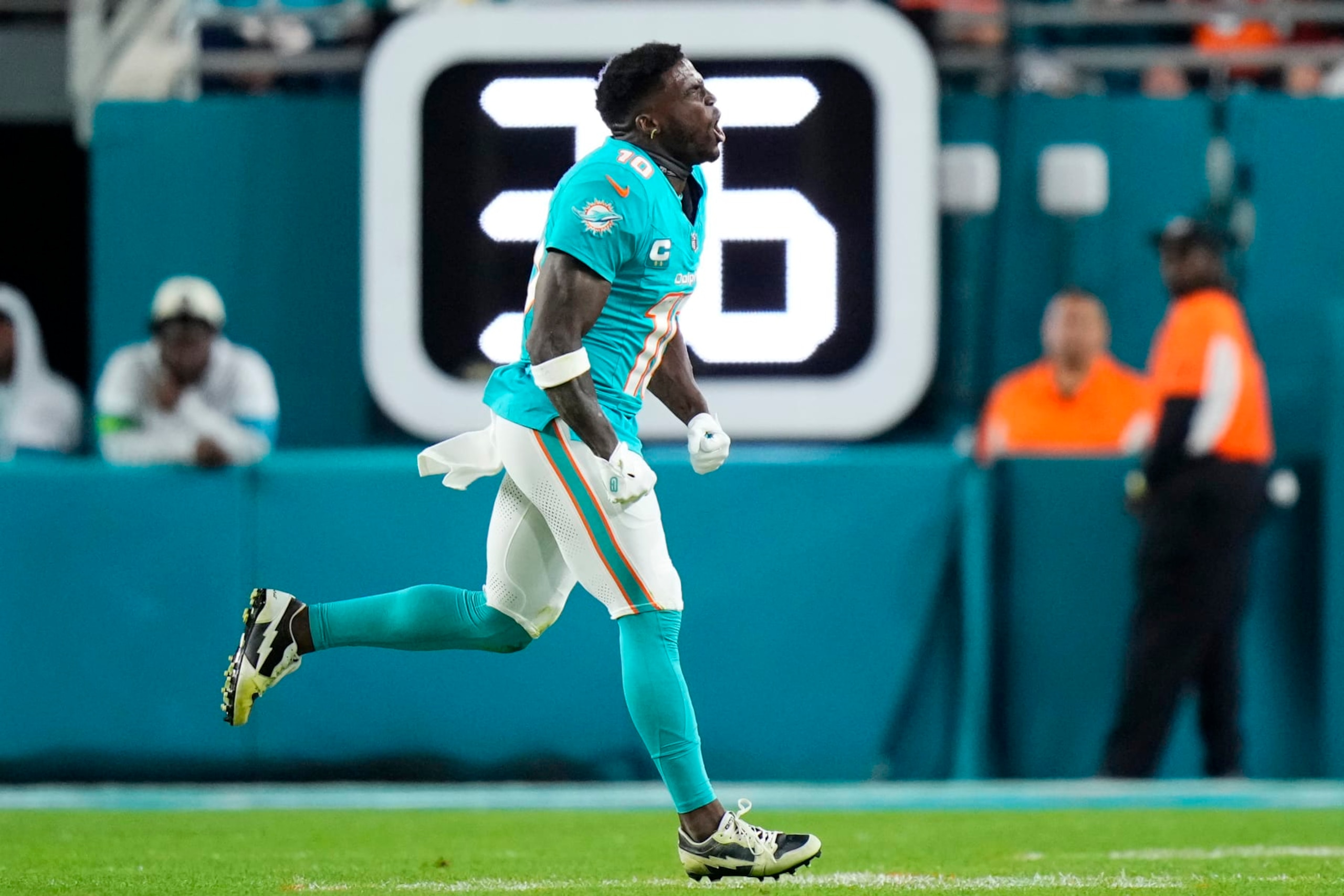 MIAMI GARDENS, FLORIDA - DECEMBER 11: Tyreek Hill #10 of the Miami Dolphins runs to the sidelines in the first half at Hard Rock Stadium on December 11, 2023 in Miami Gardens, Florida. (Photo by Rich Storry/Getty Images) MIAMI GARDENS, FLORIDA - DECEMBER 11: Tyreek Hill #10 of the Miami Dolphins runs to the sidelines in the first half at Hard Rock Stadium on December 11, 2023 in Miami Gardens, Florida. (Photo by Rich Storry/Getty Images)