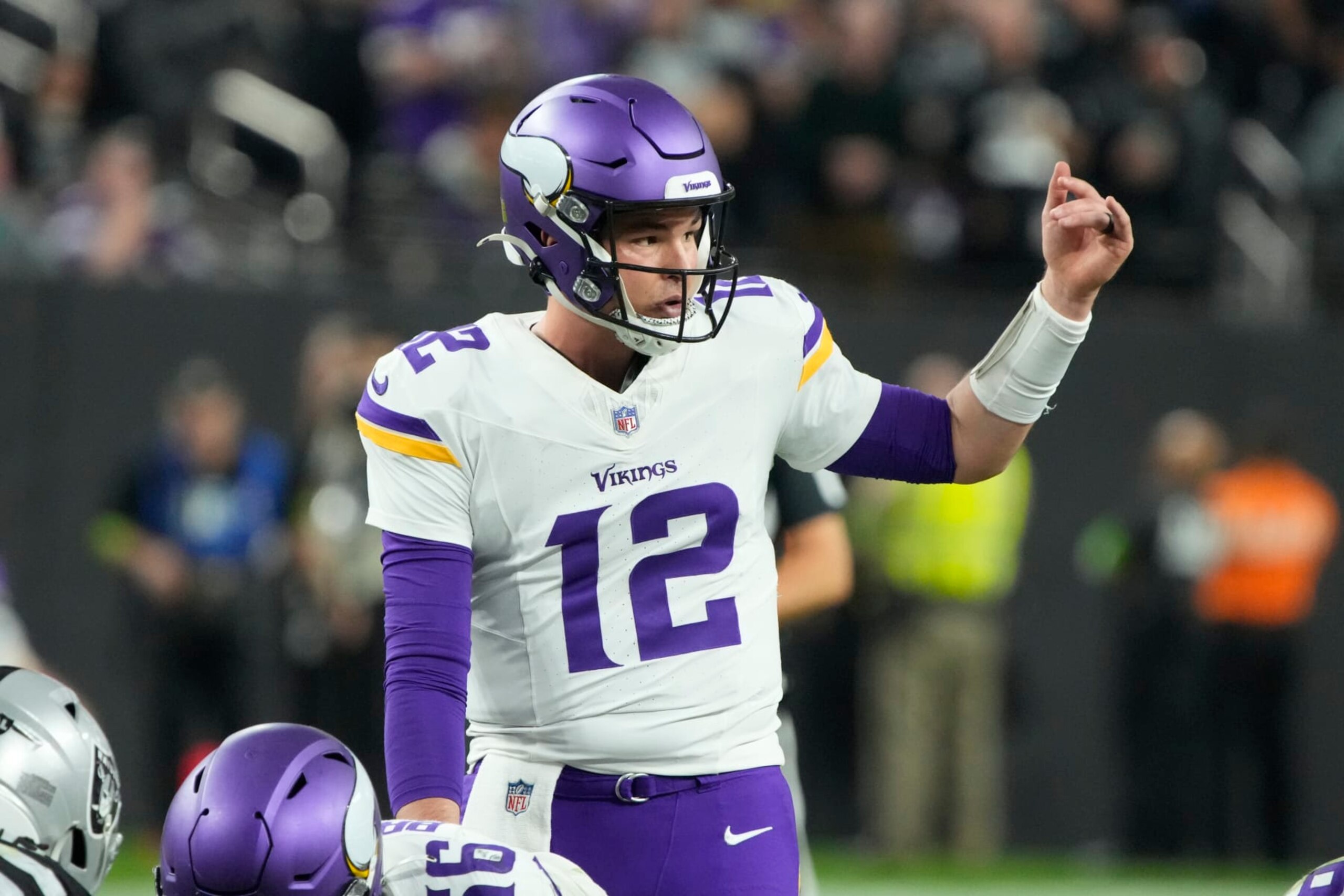 Minnesota Vikings quarterback Nick Mullens (12) lines up against the Las Vegas Raiders during the first half of an NFL football game, Sunday, Dec. 10, 2023, in Las Vegas. (AP Photo/Rick Scuteri)