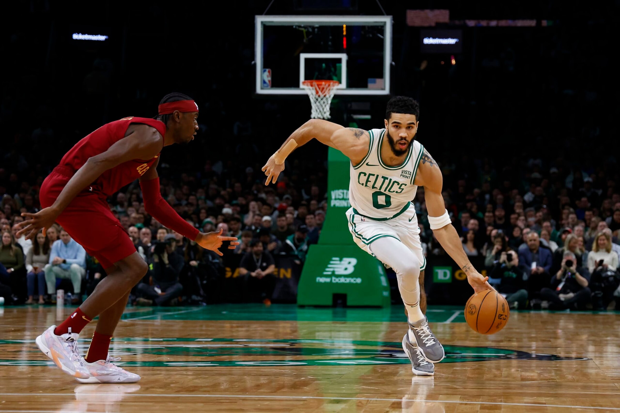BOSTON, MA - DECEMBER 12: Jayson Tatum #0 of the Boston Celtics drives past Caris LeVert #3 of the Cleveland Cavaliers during the first quarter at TD Garden on December 12, 2023 in Boston, Massachusetts. NOTE TO USER: User expressly acknowledges and agrees that, by downloading and/or using this Photograph, user is consenting to the terms and conditions of the Getty Images License Agreement. (Photo By Winslow Townson/Getty Images)