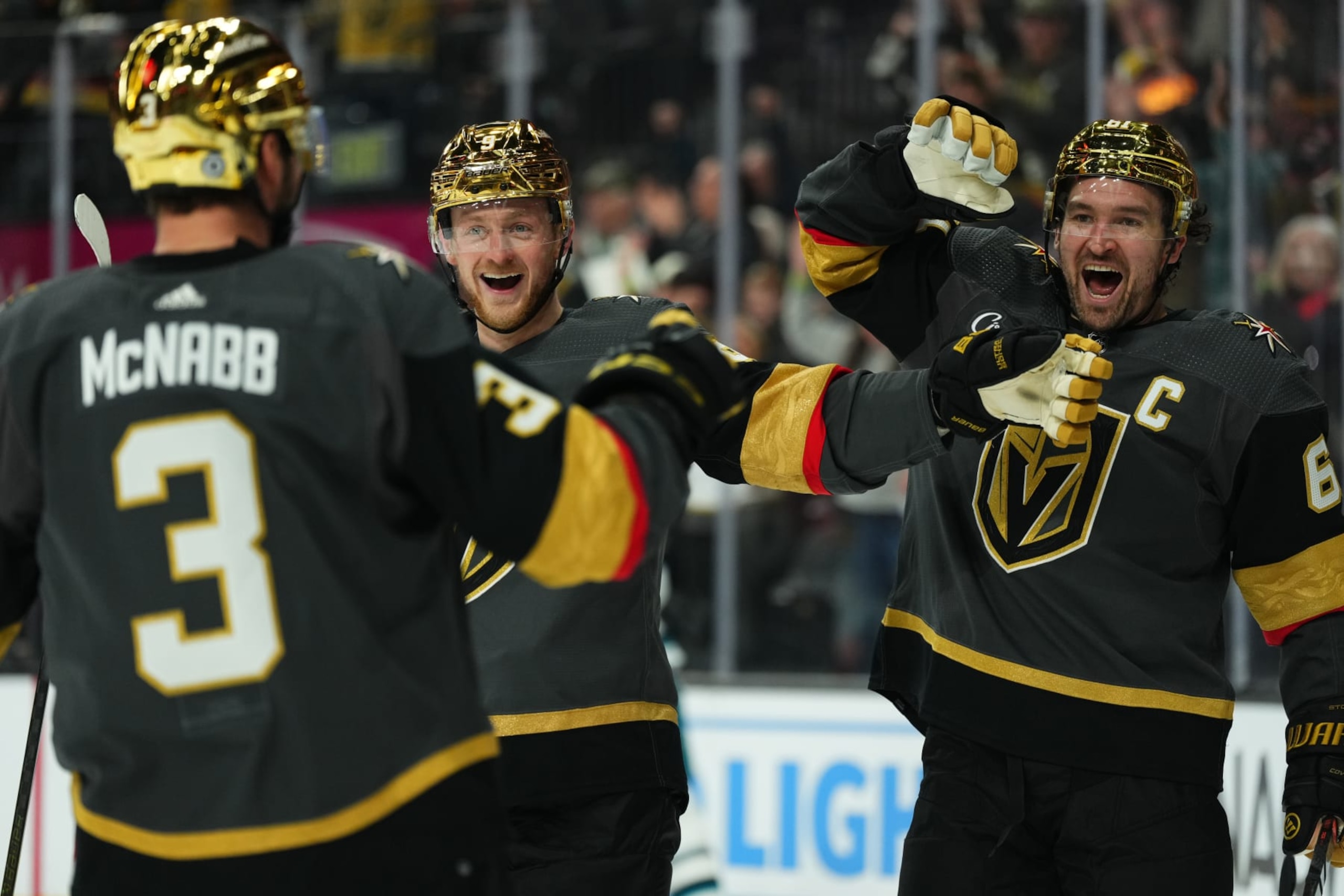 LAS VEGAS, NEVADA - DECEMBER 10: Jack Eichel #9 and Mark Stone #61 of the Vegas Golden Knights react after a goal by Brayden McNabb #3 during the third period against the San Jose Sharks at T-Mobile Arena on December 10, 2023 in Las Vegas, Nevada. (Photo by Jeff Bottari/NHLI via Getty Images)