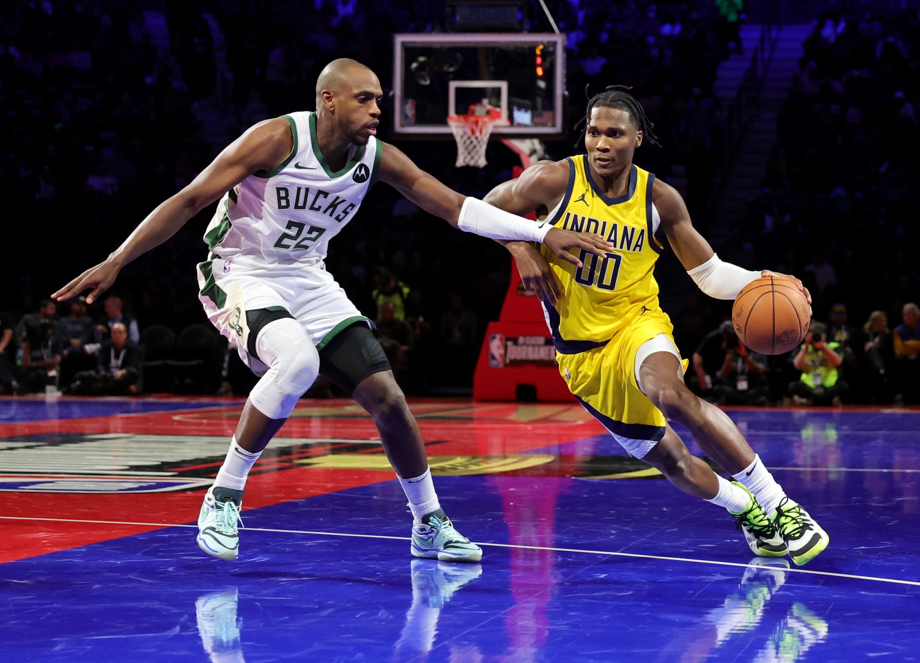 LAS VEGAS, NEVADA - DECEMBER 07: Bennedict Mathurin #00 of the Indiana Pacers drives against Khris Middleton #22 of the Milwaukee Bucks in the first half of the East semifinal game of the inaugural NBA In-Season Tournament at T-Mobile Arena on December 07, 2023 in Las Vegas, Nevada. The Pacers defeated the Bucks 128-119. NOTE TO USER: User expressly acknowledges and agrees that, by downloading and or using this photograph, User is consenting to the terms and conditions of the Getty Images License Agreement. (Photo by Ethan Miller/Getty Images)