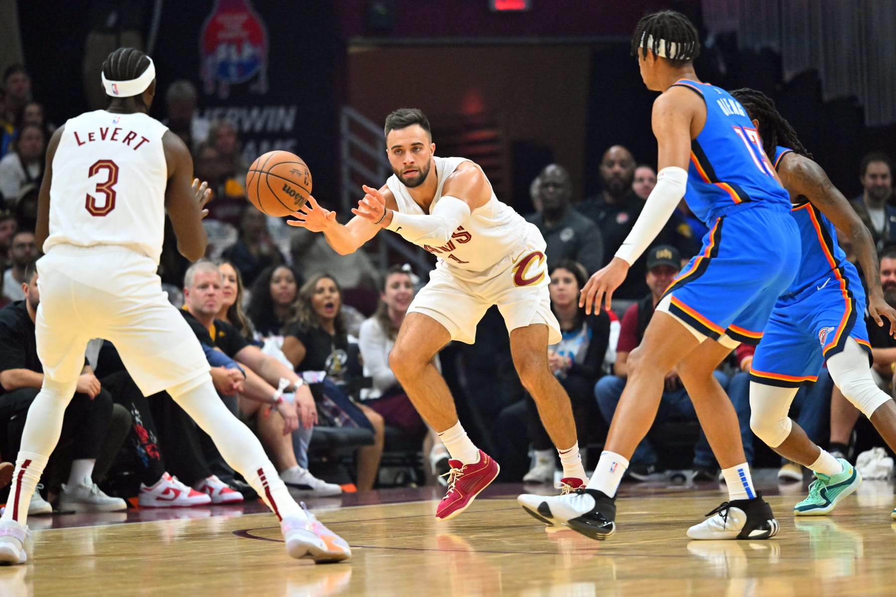 CLEVELAND, OHIO - OCTOBER 27: Max Strus #1 passes to Caris LeVert #3 of the Cleveland Cavaliers passes the ball during the second quarter at Rocket Mortgage Fieldhouse on October 27, 2023 in Cleveland, Ohio. NOTE TO USER: User expressly acknowledges and agrees that, by downloading and or using this photograph, User is consenting to the terms and conditions of the Getty Images License Agreement. (Photo by Jason Miller/Getty Images)