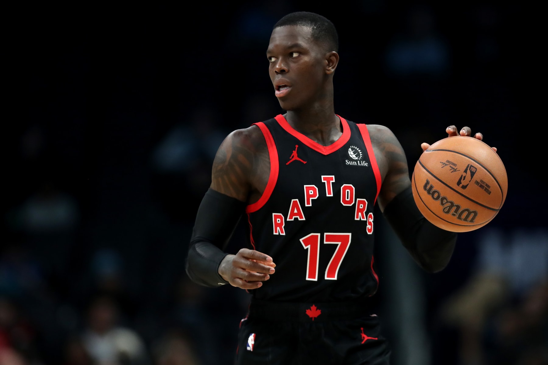 CHARLOTTE, NORTH CAROLINA - DECEMBER 08: Dennis Schroder #17 of the Toronto Raptors brings the ball down the court during the first half of an NBA game against the Charlotte Hornets at Spectrum Center on December 08, 2023 in Charlotte, North Carolina. NOTE TO USER: User expressly acknowledges and agrees that, by downloading and or using this photograph, User is consenting to the terms and conditions of the Getty Images License Agreement. (Photo by David Jensen/Getty Images)