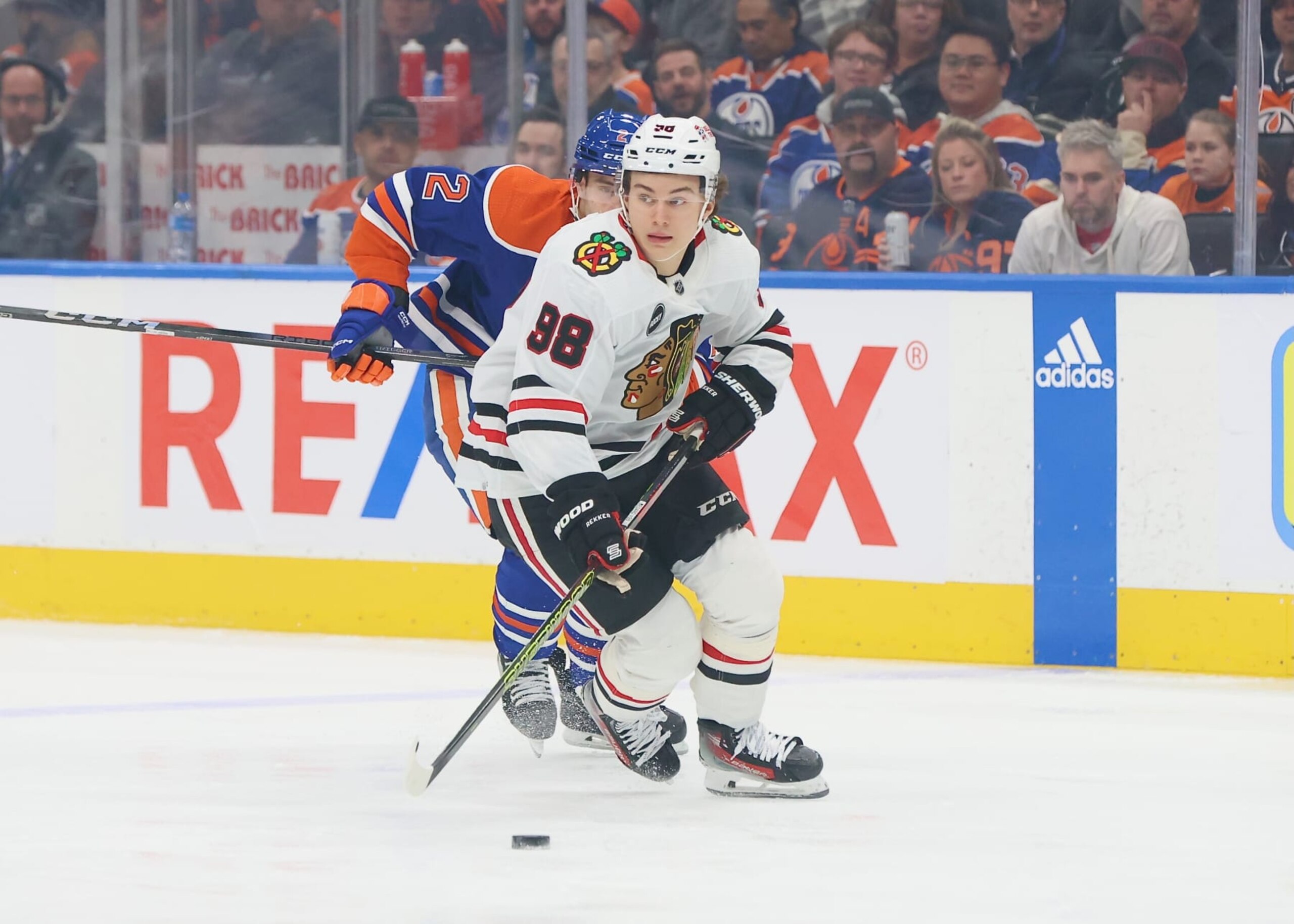 EDMONTON, CANADA - DECEMBER 12: Connor Bedard #98 of the Chicago Blackhawks skates with the puck in the first period against the Edmonton Oilers on December 12, 2023 at Rogers Place in Edmonton, Alberta, Canada. (Photo by Lawrence Scott/Getty Images)