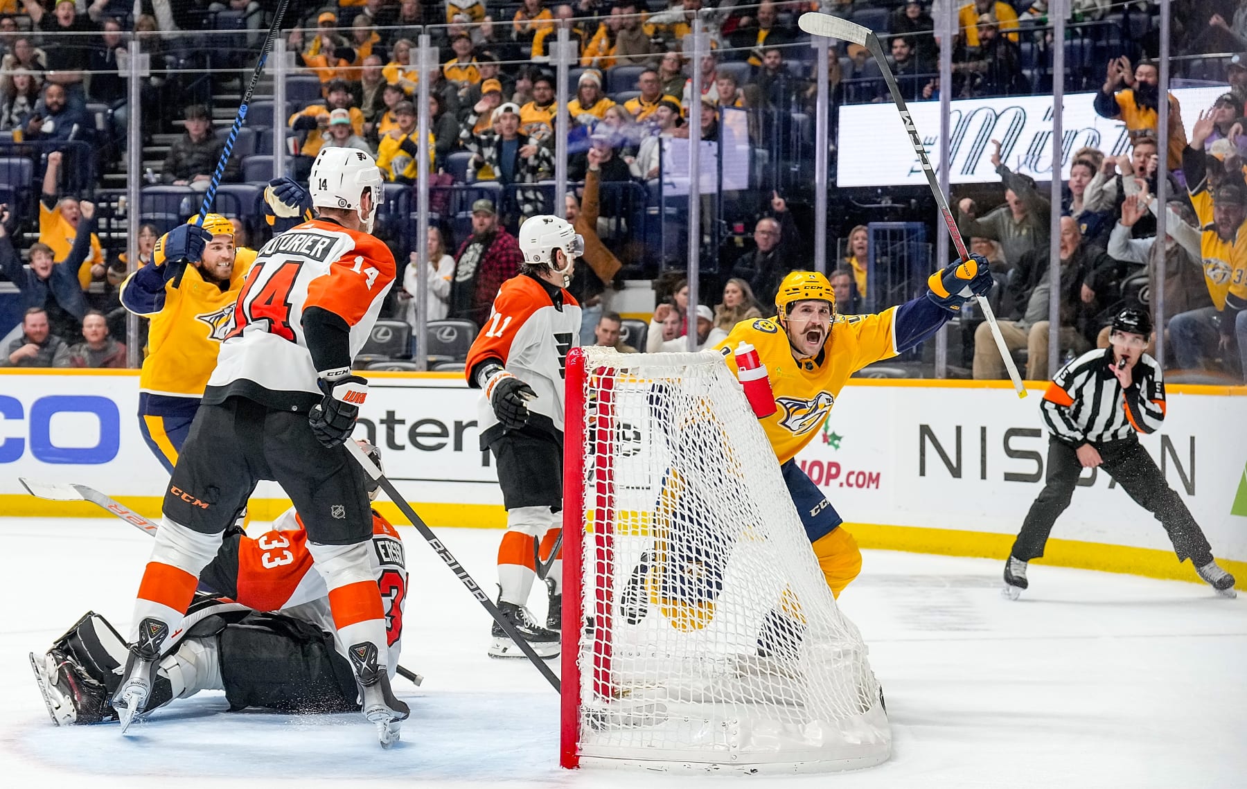 NASHVILLE, TENNESSEE - DECEMBER 12: Filip Forsberg #9 of the Nashville Predators celebrates his overtime game winning goal against Samuel Ersson #33 of the Philadelphia Flyers during an NHL game at Bridgestone Arena on December 12, 2023 in Nashville, Tennessee. (Photo by John Russell/NHLI via Getty Images)