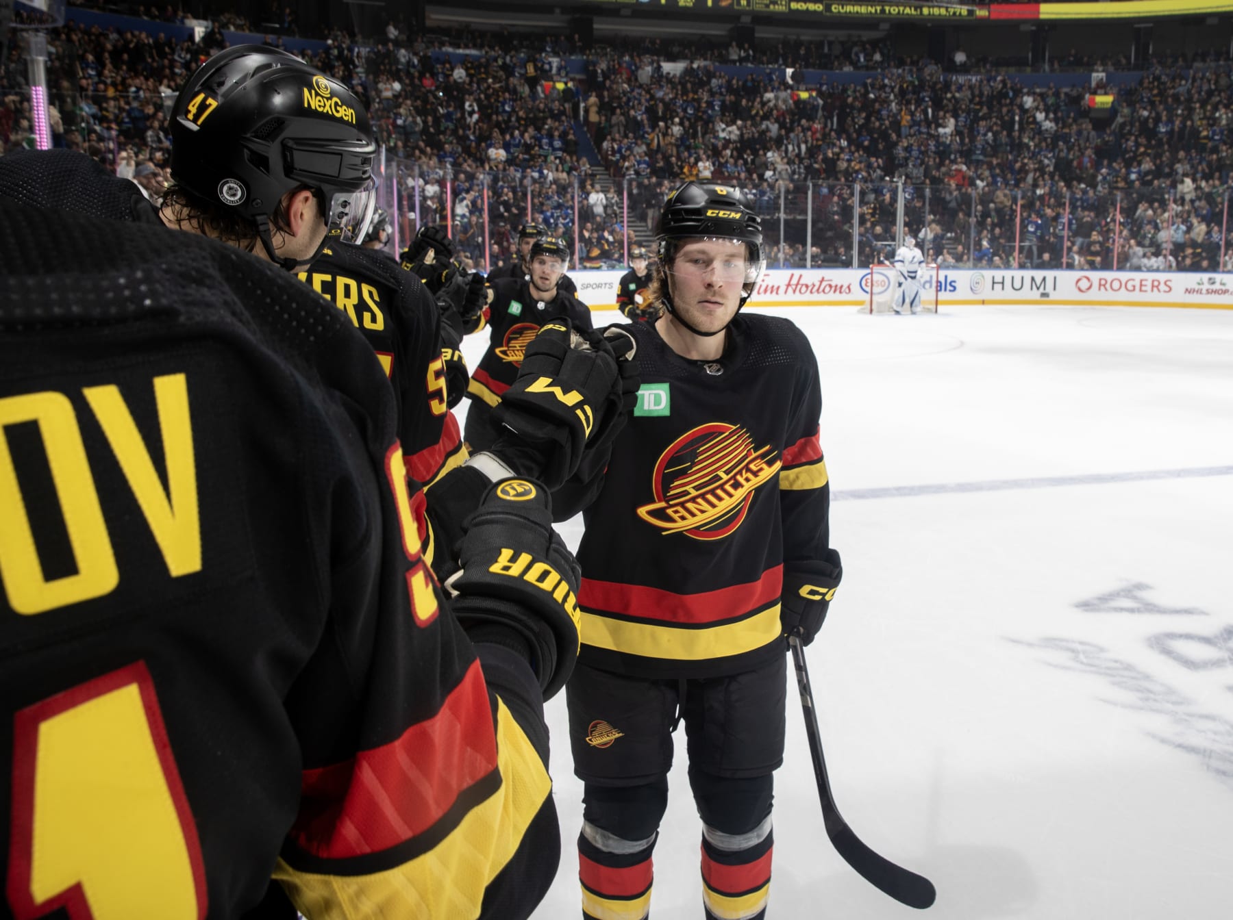 VANCOUVER, CANADA - DECEMBER 12: Brock Boeser #6 of the Vancouver Canucks celebrates his goal with teammates during the second period of their NHL game against the Tampa Bay Lightningat Rogers Arena on December 12, 2023 in Vancouver, British Columbia, Canada.  (Photo by Jeff Vinnick/NHLI via Getty Images)