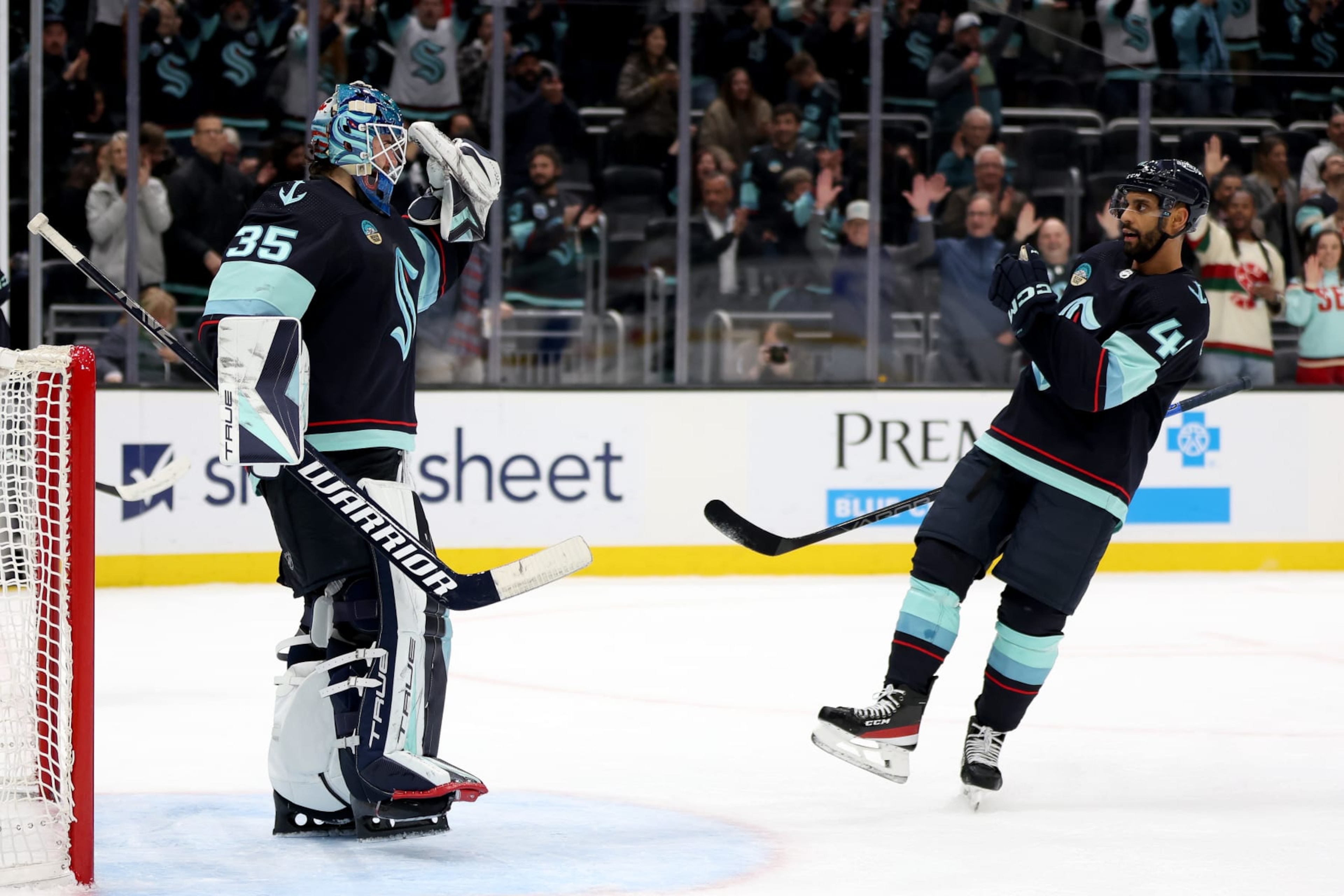 SEATTLE, WASHINGTON - DECEMBER 12: Joey Daccord #35 of the Seattle Kraken celebrates his first NHL shutout with Pierre-Edouard Bellemare #41 against Florida Panthers at Climate Pledge Arena on December 12, 2023 in Seattle, Washington. (Photo by Steph Chambers/Getty Images) SEATTLE, WASHINGTON - DECEMBER 12: Joey Daccord #35 of the Seattle Kraken celebrates his first NHL shutout with Pierre-Edouard Bellemare #41 against Florida Panthers at Climate Pledge Arena on December 12, 2023 in Seattle, Washington. (Photo by Steph Chambers/Getty Images)