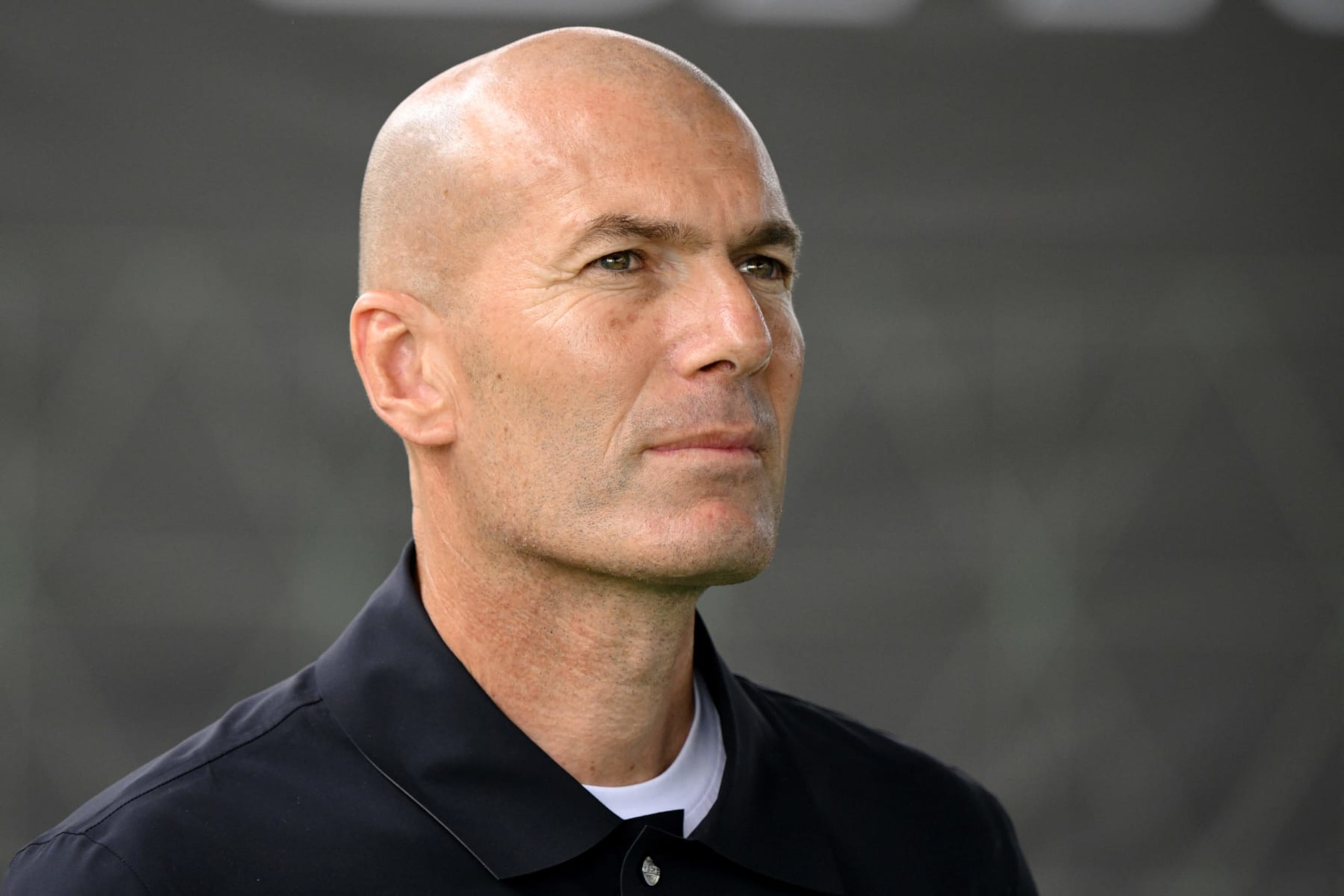 Former French footballer Zinedine Zidane looks on during a promotional day with gaming brand EA Sports at the Z5 sports complex in Aix-en-Provence, southern France, on June 21, 2023. Electronic Arts Inc announced FC FUTURES, a major programme to invest in community football worldwide with the aim of growing the sport for all. The programme will see investment over the next three years in a number of local football projects. This announcement follows the revelation by EA SPORTS of its new identity, new logo and new vision for the future of interactive football: EA SPORTS FC. (Photo by Nicolas TUCAT / AFP) (Photo by NICOLAS TUCAT/AFP via Getty Images) Former French footballer Zinedine Zidane looks on during a promotional day with gaming brand EA Sports at the Z5 sports complex in Aix-en-Provence, southern France, on June 21, 2023. Electronic Arts Inc announced FC FUTURES, a major programme to invest in community football worldwide with the aim of growing the sport for all. The programme will see investment over the next three years in a number of local football projects. This announcement follows the revelation by EA SPORTS of its new identity, new logo and new vision for the future of interactive football: EA SPORTS FC. (Photo by Nicolas TUCAT / AFP) (Photo by NICOLAS TUCAT/AFP via Getty Images)