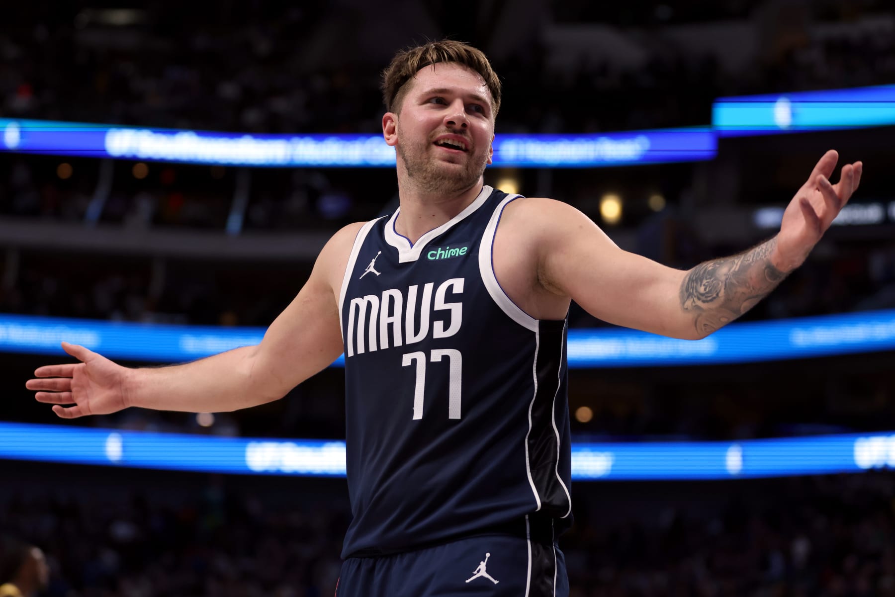 DALLAS, TEXAS - DECEMBER 12: Luka Doncic #77 of the Dallas Mavericks reacts after a foul call in the first half against the Los Angeles Lakers at American Airlines Center on December 12, 2023 in Dallas, Texas.  NOTE TO USER: User expressly acknowledges and agrees that, by downloading and or using this photograph, User is consenting to the terms and conditions of the Getty Images License Agreement. (Photo by Tim Heitman/Getty Images)
