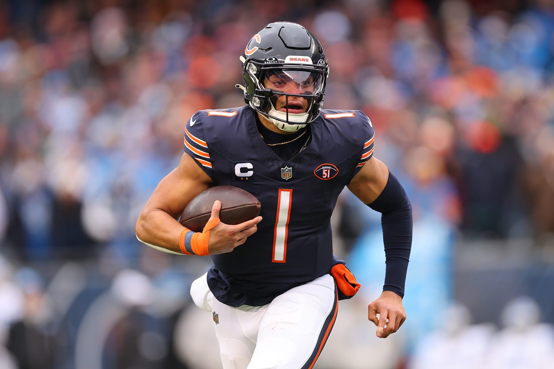 CHICAGO, ILLINOIS - DECEMBER 10: Justin Fields #1 of the Chicago Bears runs the ball during the first quarter in the game against the Detroit Lions at Soldier Field on December 10, 2023 in Chicago, Illinois. (Photo by Michael Reaves/Getty Images)