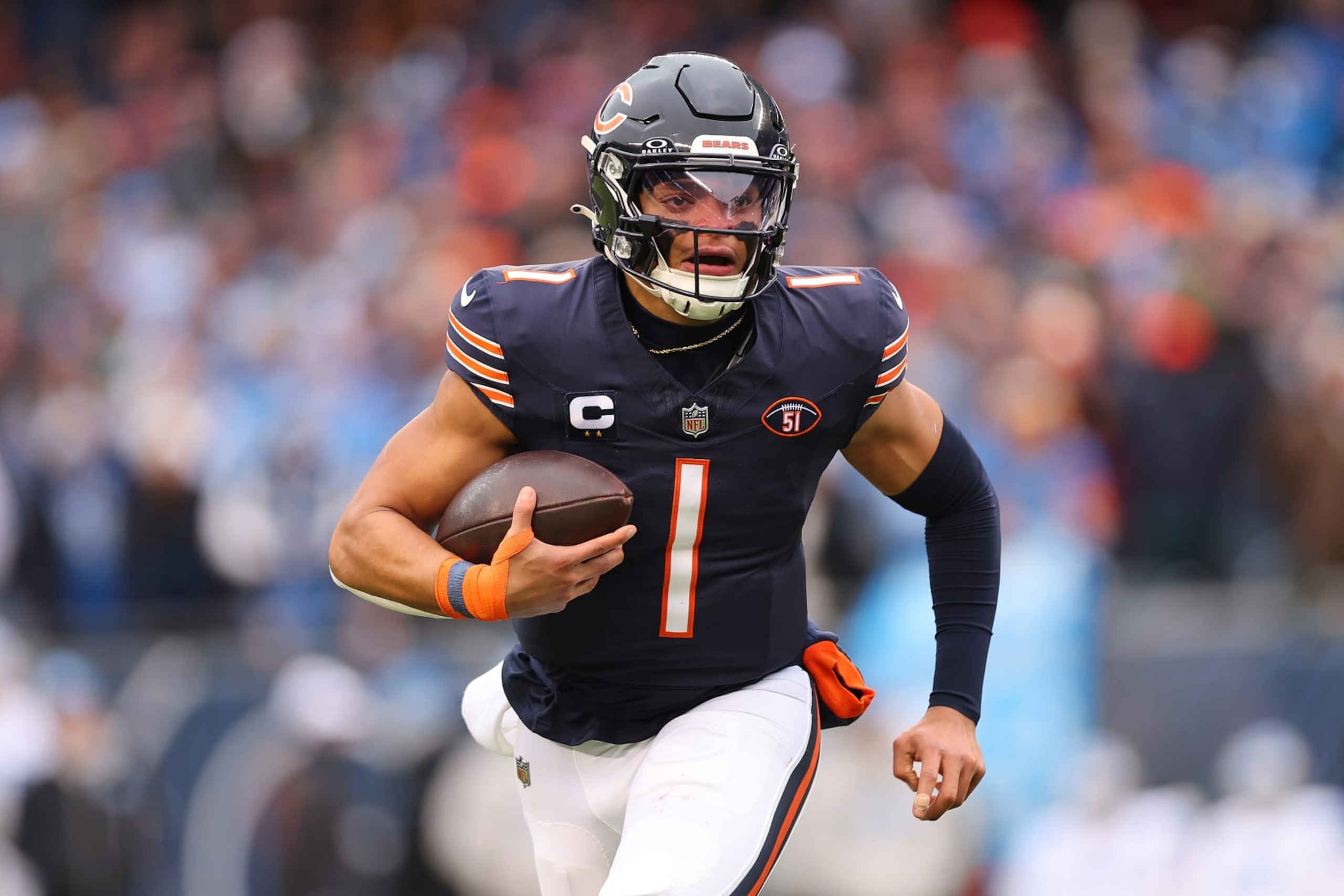 CHICAGO, ILLINOIS - DECEMBER 10: Justin Fields #1 of the Chicago Bears runs the ball during the first quarter in the game against the Detroit Lions at Soldier Field on December 10, 2023 in Chicago, Illinois. (Photo by Michael Reaves/Getty Images) CHICAGO, ILLINOIS - DECEMBER 10: Justin Fields #1 of the Chicago Bears runs the ball during the first quarter in the game against the Detroit Lions at Soldier Field on December 10, 2023 in Chicago, Illinois. (Photo by Michael Reaves/Getty Images)