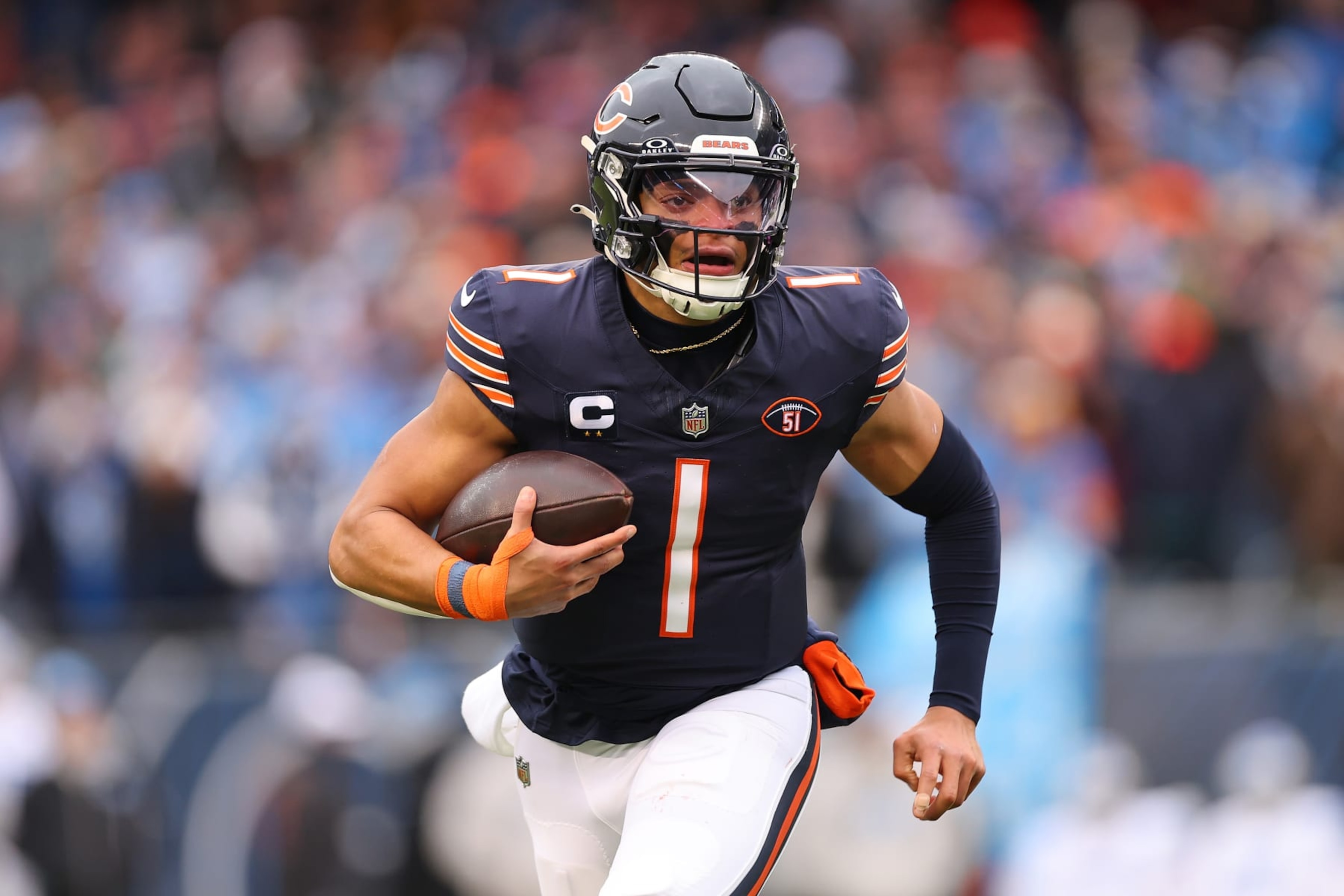 CHICAGO, ILLINOIS - DECEMBER 10: Justin Fields #1 of the Chicago Bears runs the ball during the first quarter in the game against the Detroit Lions at Soldier Field on December 10, 2023 in Chicago, Illinois. (Photo by Michael Reaves/Getty Images) CHICAGO, ILLINOIS - DECEMBER 10: Justin Fields #1 of the Chicago Bears runs the ball during the first quarter in the game against the Detroit Lions at Soldier Field on December 10, 2023 in Chicago, Illinois. (Photo by Michael Reaves/Getty Images)