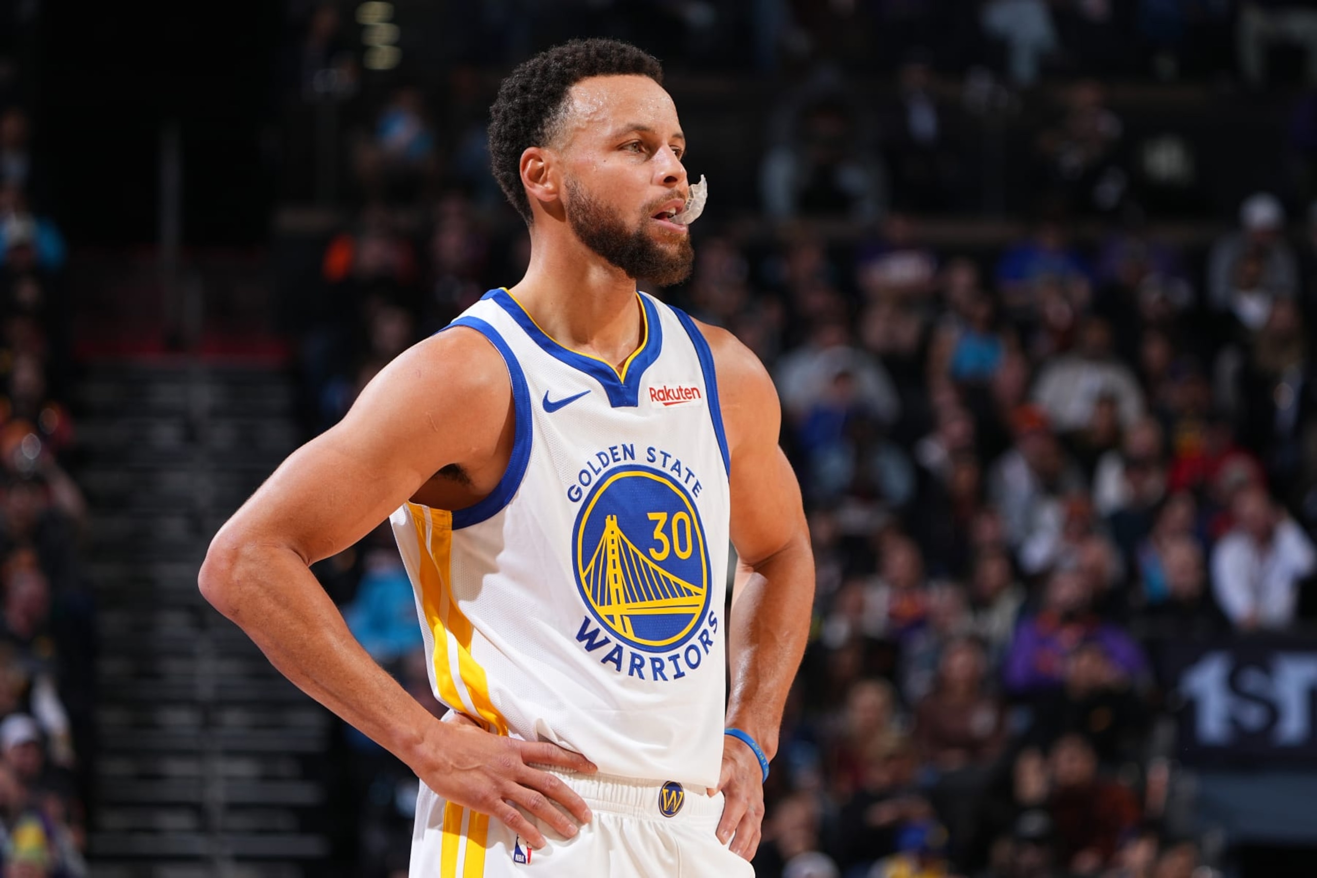 PHOENIX, AZ - DECEMBER 12: Stephen Curry #30 of the Golden State Warriors looks on during the game against the Phoenix Suns on December 12, 2023 at Footprint Center in Phoenix, Arizona. NOTE TO USER: User expressly acknowledges and agrees that, by downloading and or using this photograph, user is consenting to the terms and conditions of the Getty Images License Agreement. Mandatory Copyright Notice: Copyright 2023 NBAE (Photo by Garrett Ellwood/NBAE via Getty Images)