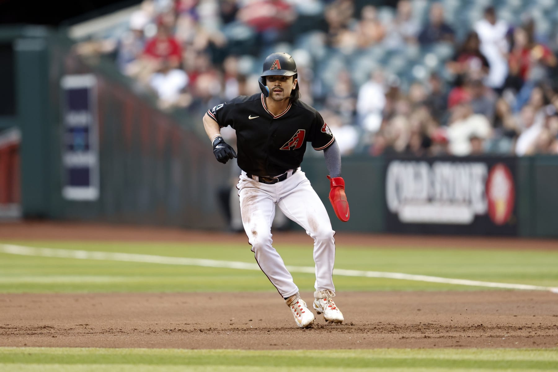 PHOENIX, ARIZONA - MAY 31: Corbin Carroll #7 of the Arizona Diamondbacks leads off first base during the game against the Colorado Rockies at Chase Field on May 31, 2023 in Phoenix, Arizona. The Diamondbacks defeated the Rockies 6-0. (Photo by Chris Coduto/Getty Images)