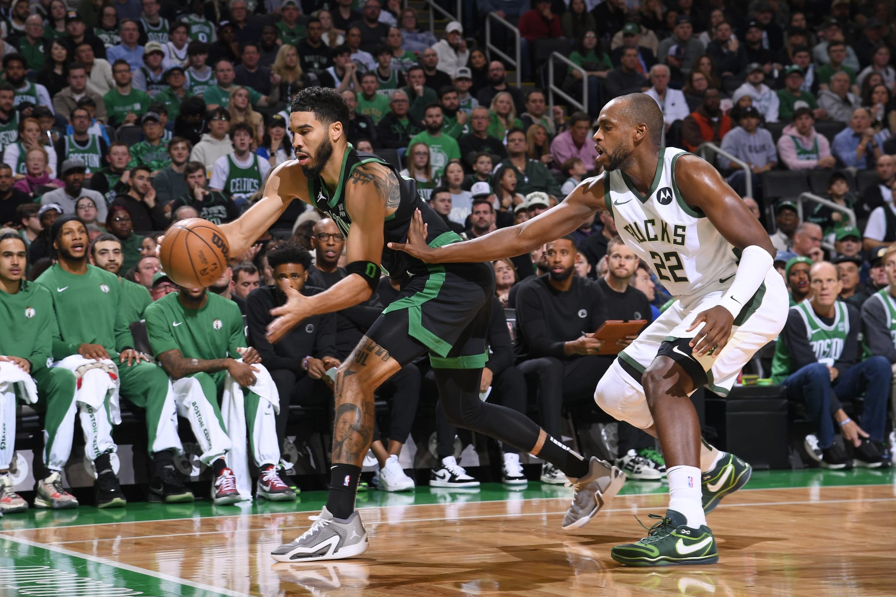 BOSTON, MA - NOVEMBER 22:  Jayson Tatum #0 of the Boston Celtics goes after the loose ball during the game against the Milwaukee Bucks on November 22, 2023 at the TD Garden in Boston, Massachusetts. NOTE TO USER: User expressly acknowledges and agrees that, by downloading and or using this photograph, User is consenting to the terms and conditions of the Getty Images License Agreement. Mandatory Copyright Notice: Copyright 2023 NBAE  (Photo by Brian Babineau/NBAE via Getty Images)