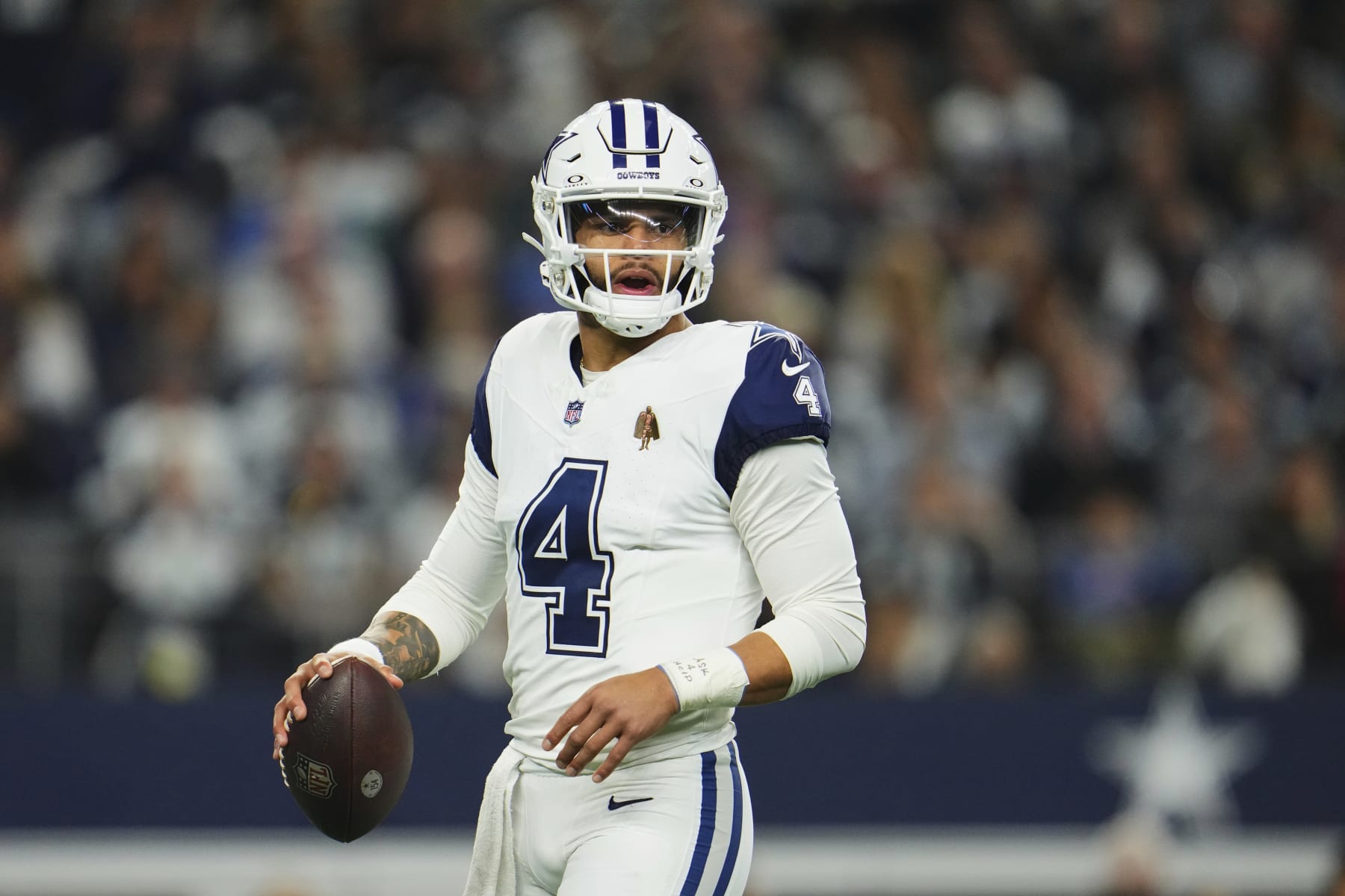 ARLINGTON, TX - DECEMBER 10: Dak Prescott #4 of the Dallas Cowboys looks towards the sideline against the Philadelphia Eagles during the first half at AT&T Stadium on December 10, 2023 in Arlington, Texas. (Photo by Cooper Neill/Getty Images)