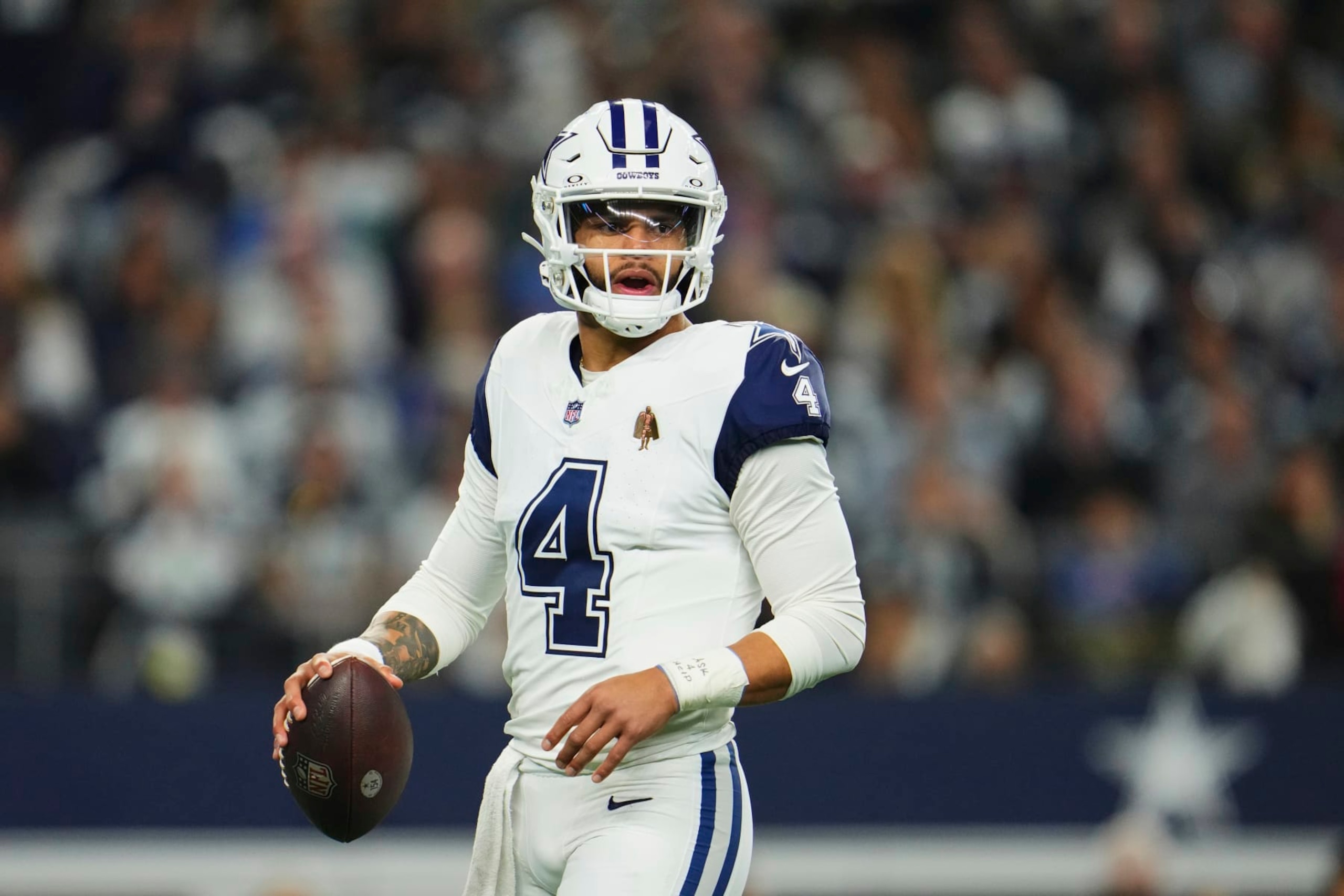 ARLINGTON, TX - DECEMBER 10: Dak Prescott #4 of the Dallas Cowboys looks towards the sideline against the Philadelphia Eagles during the first half at AT&T Stadium on December 10, 2023 in Arlington, Texas. (Photo by Cooper Neill/Getty Images)