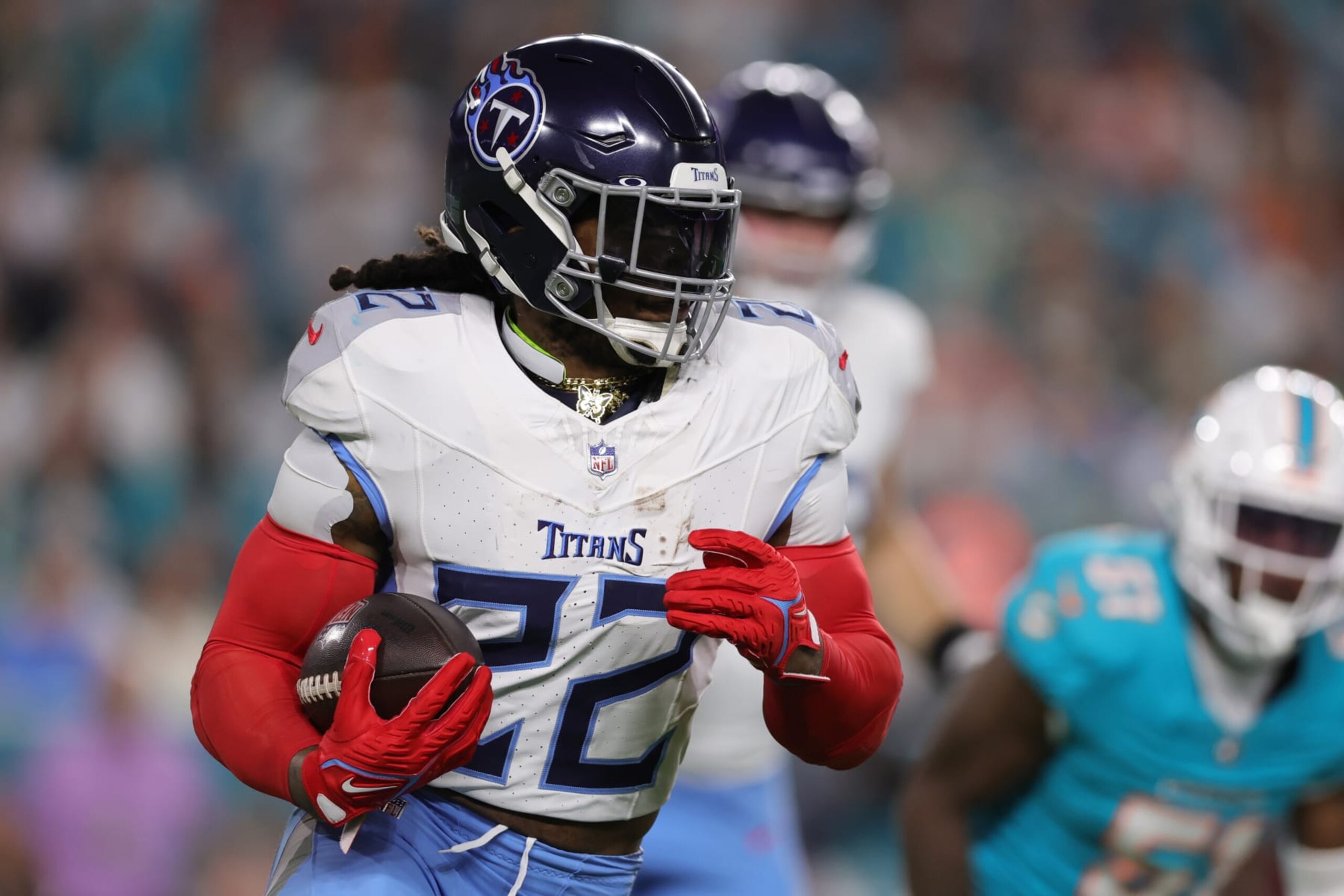 MIAMI GARDENS, FLORIDA - DECEMBER 11: Derrick Henry #22 of the Tennessee Titans runs the ball in the first half against the Miami Dolphins at Hard Rock Stadium on December 11, 2023 in Miami Gardens, Florida. (Photo by Megan Briggs/Getty Images)