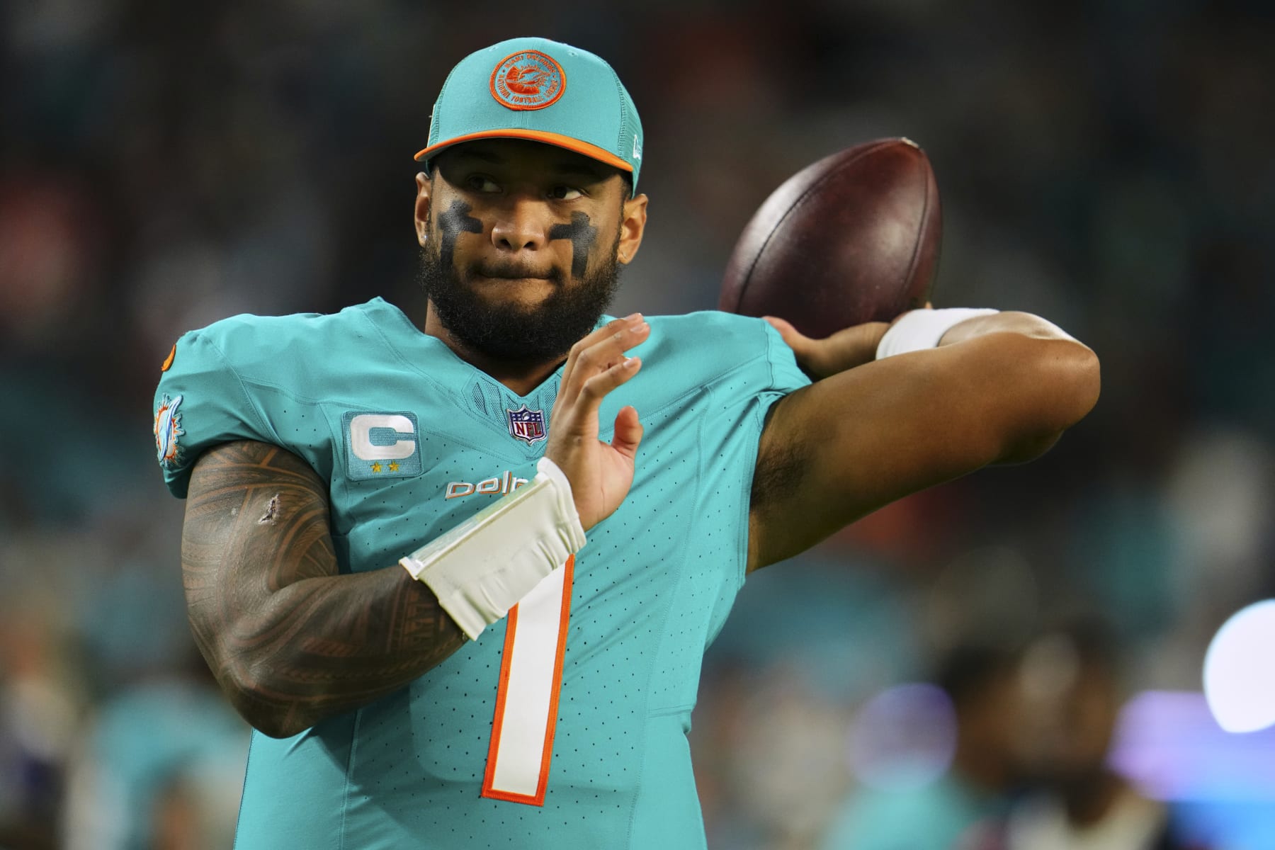 MIAMI GARDENS, FL - DECEMBER 11: Tua Tagovailoa #1 of the Miami Dolphins warms up before kickoff against the Tennessee Titans at Hard Rock Stadium on December 11, 2023 in Miami Gardens, Florida. (Photo by Cooper Neill/Getty Images)