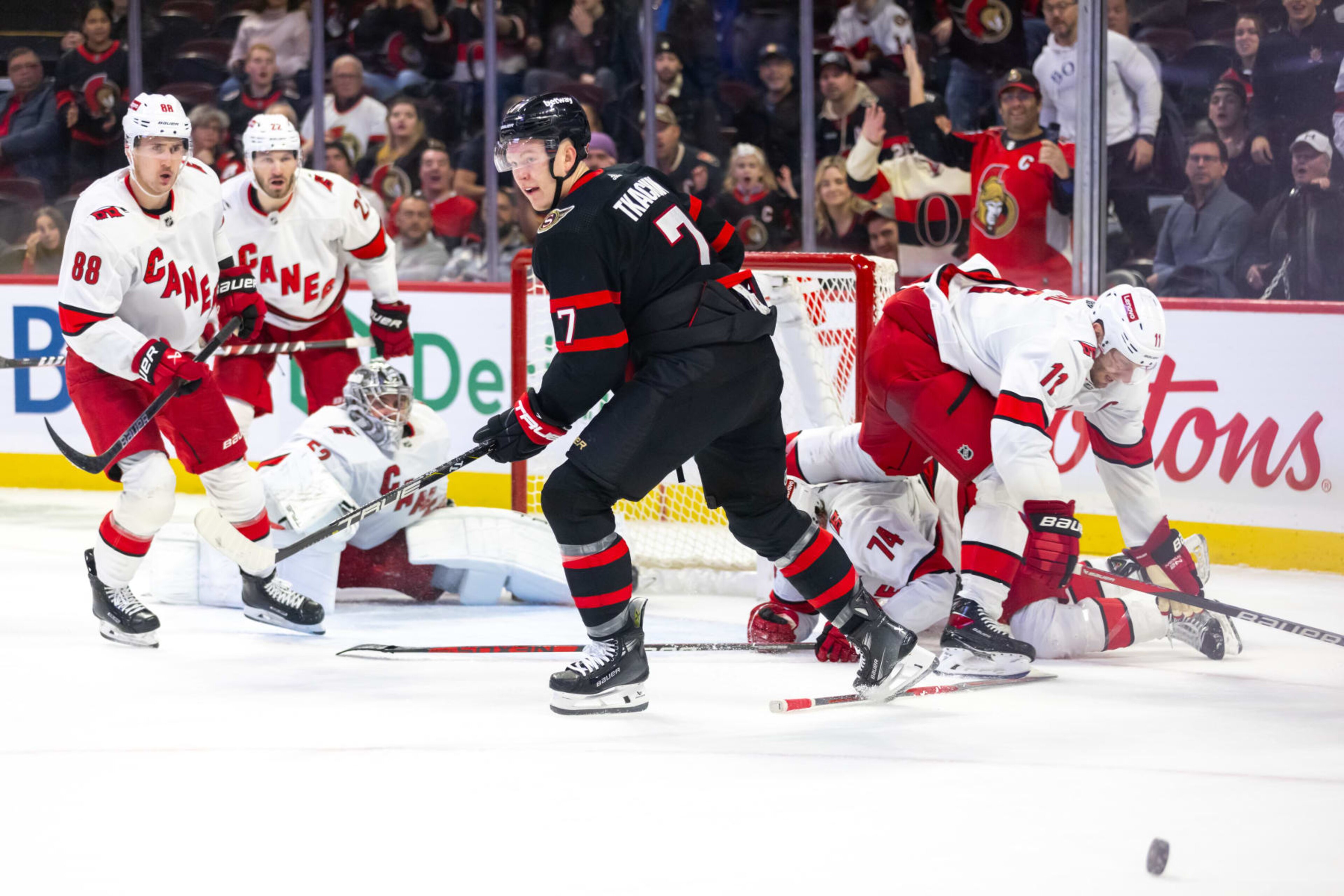 OTTAWA, ON - DECEMBER 12: Ottawa Senators Left Wing Brady Tkachuk (7) loses track of the puck after a scramble in front of the Carolina Hurricanes net during third period National Hockey League action between the Carolina Hurricanes and Ottawa Senators on December 12, 2023, at Canadian Tire Centre in Ottawa, ON, Canada. (Photo by Richard A. Whittaker/Icon Sportswire via Getty Images) OTTAWA, ON - DECEMBER 12: Ottawa Senators Left Wing Brady Tkachuk (7) loses track of the puck after a scramble in front of the Carolina Hurricanes net during third period National Hockey League action between the Carolina Hurricanes and Ottawa Senators on December 12, 2023, at Canadian Tire Centre in Ottawa, ON, Canada. (Photo by Richard A. Whittaker/Icon Sportswire via Getty Images)
