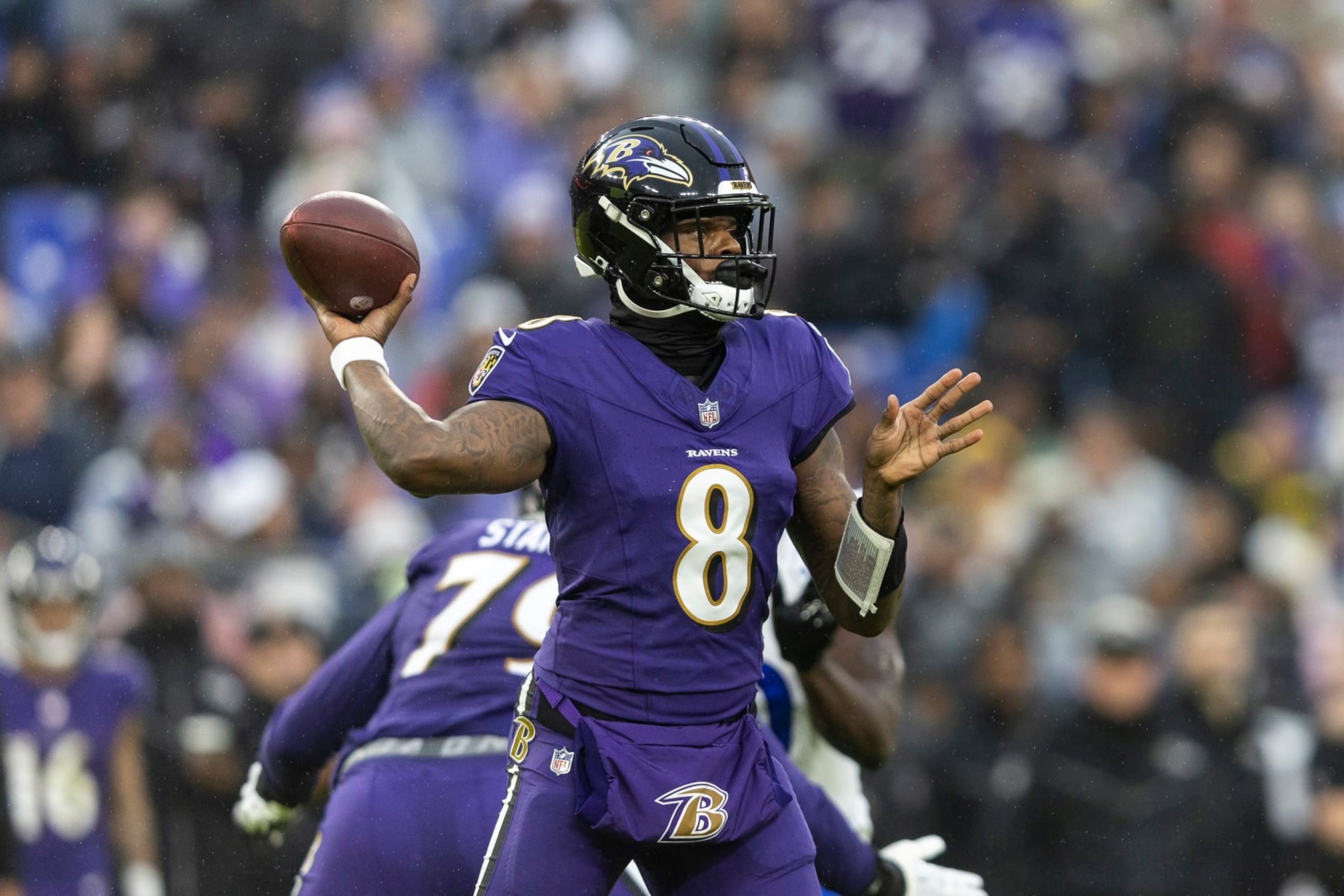 BALTIMORE, MARYLAND - DECEMBER 10: Lamar Jackson #8 of the Baltimore Ravens throws a pass during an NFL football game between the Baltimore Ravens and the Los Angeles Rams at M&T Bank Stadium on December 10, 2023 in Baltimore, Maryland. (Photo by Michael Owens/Getty Images)