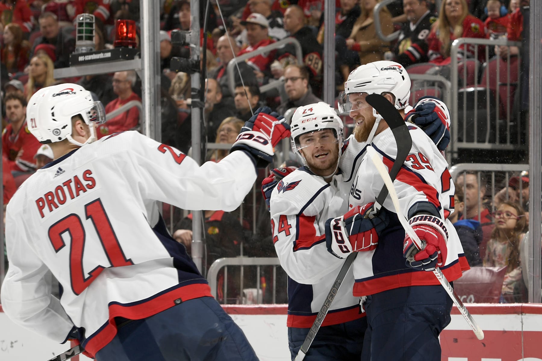 CHICAGO, ILLINOIS - DECEMBER 10: Connor McMichael #24 of the Washington Capitals hugs Anthony Mantha #39 of the Washington Capitals after Mantha scores against the Chicago Blackhawks at the United Center on December 10, 2023 in Chicago, Illinois. (Photo by Bill Smith/NHLI via Getty Images)