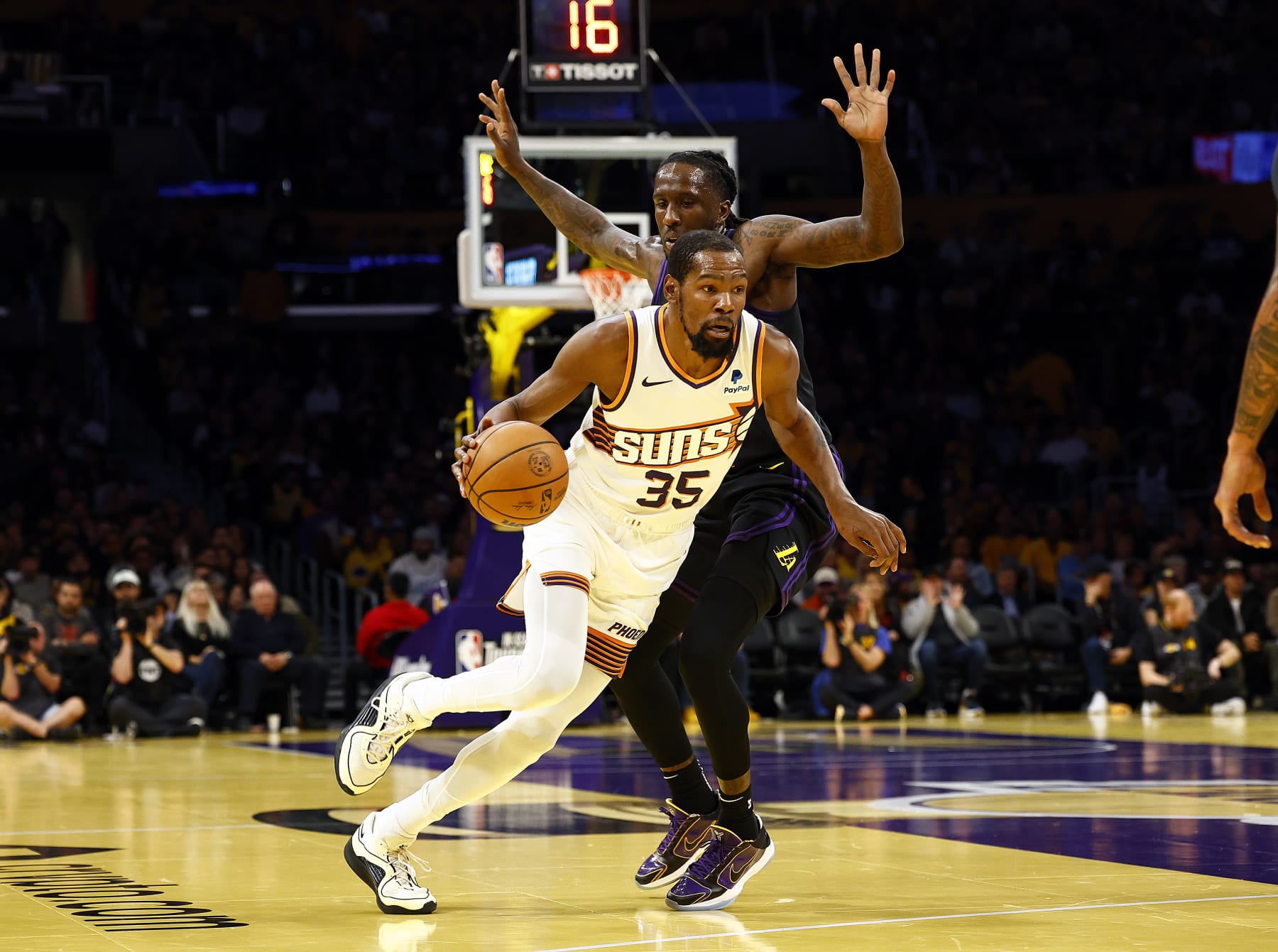 LOS ANGELES, CALIFORNIA - DECEMBER 05:  Kevin Durant #35 of the Phoenix Suns controls the ball against Taurean Prince #12 of the Los Angeles Lakers in the first half during the 2023 NBA In-Season Tournament quarterfinals at Crypto.com Arena on December 05, 2023 in Los Angeles, California.  NOTE TO USER: User expressly acknowledges and agrees that, by downloading and/or using this photograph, user is consenting to the terms and conditions of the Getty Images License Agreement. (Photo by Ronald Martinez/Getty Images)