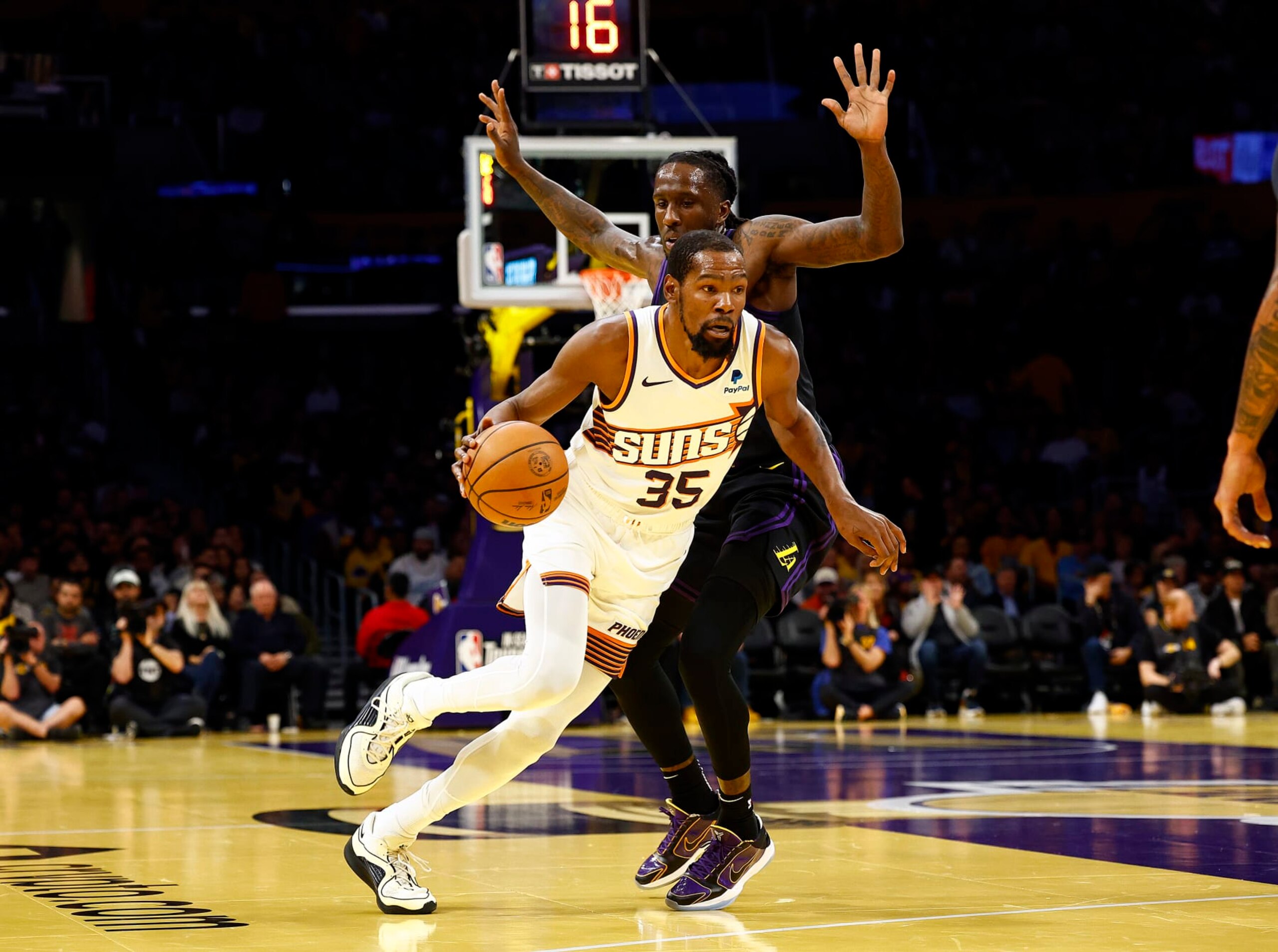 LOS ANGELES, CALIFORNIA - DECEMBER 05: Kevin Durant #35 of the Phoenix Suns controls the ball against Taurean Prince #12 of the Los Angeles Lakers in the first half during the 2023 NBA In-Season Tournament quarterfinals at Crypto.com Arena on December 05, 2023 in Los Angeles, California. NOTE TO USER: User expressly acknowledges and agrees that, by downloading and/or using this photograph, user is consenting to the terms and conditions of the Getty Images License Agreement. (Photo by Ronald Martinez/Getty Images) LOS ANGELES, CALIFORNIA - DECEMBER 05: Kevin Durant #35 of the Phoenix Suns controls the ball against Taurean Prince #12 of the Los Angeles Lakers in the first half during the 2023 NBA In-Season Tournament quarterfinals at Crypto.com Arena on December 05, 2023 in Los Angeles, California. NOTE TO USER: User expressly acknowledges and agrees that, by downloading and/or using this photograph, user is consenting to the terms and conditions of the Getty Images License Agreement. (Photo by Ronald Martinez/Getty Images)